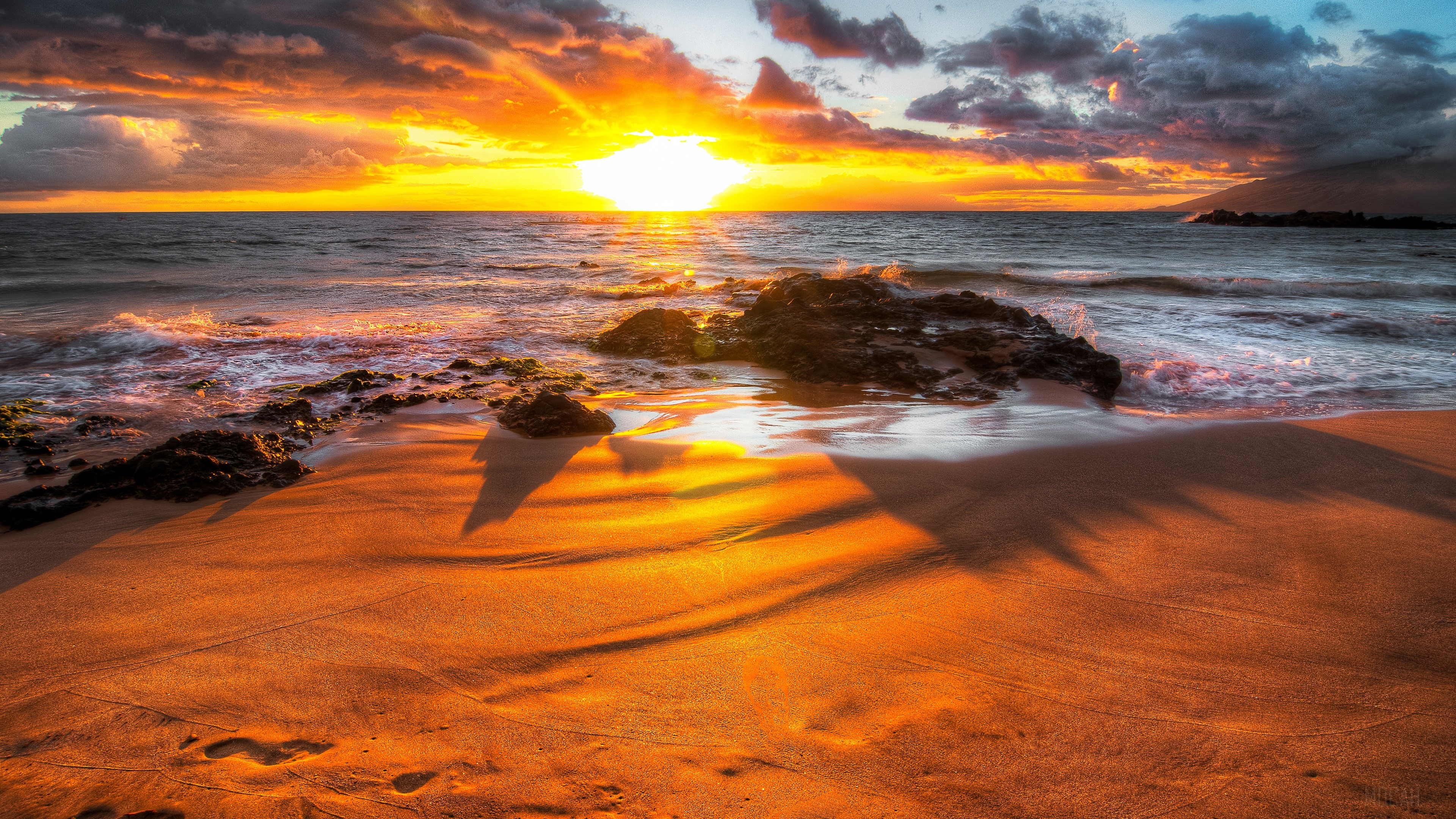 Sunset over a rocky beach with ocean waves HD Wallpaper