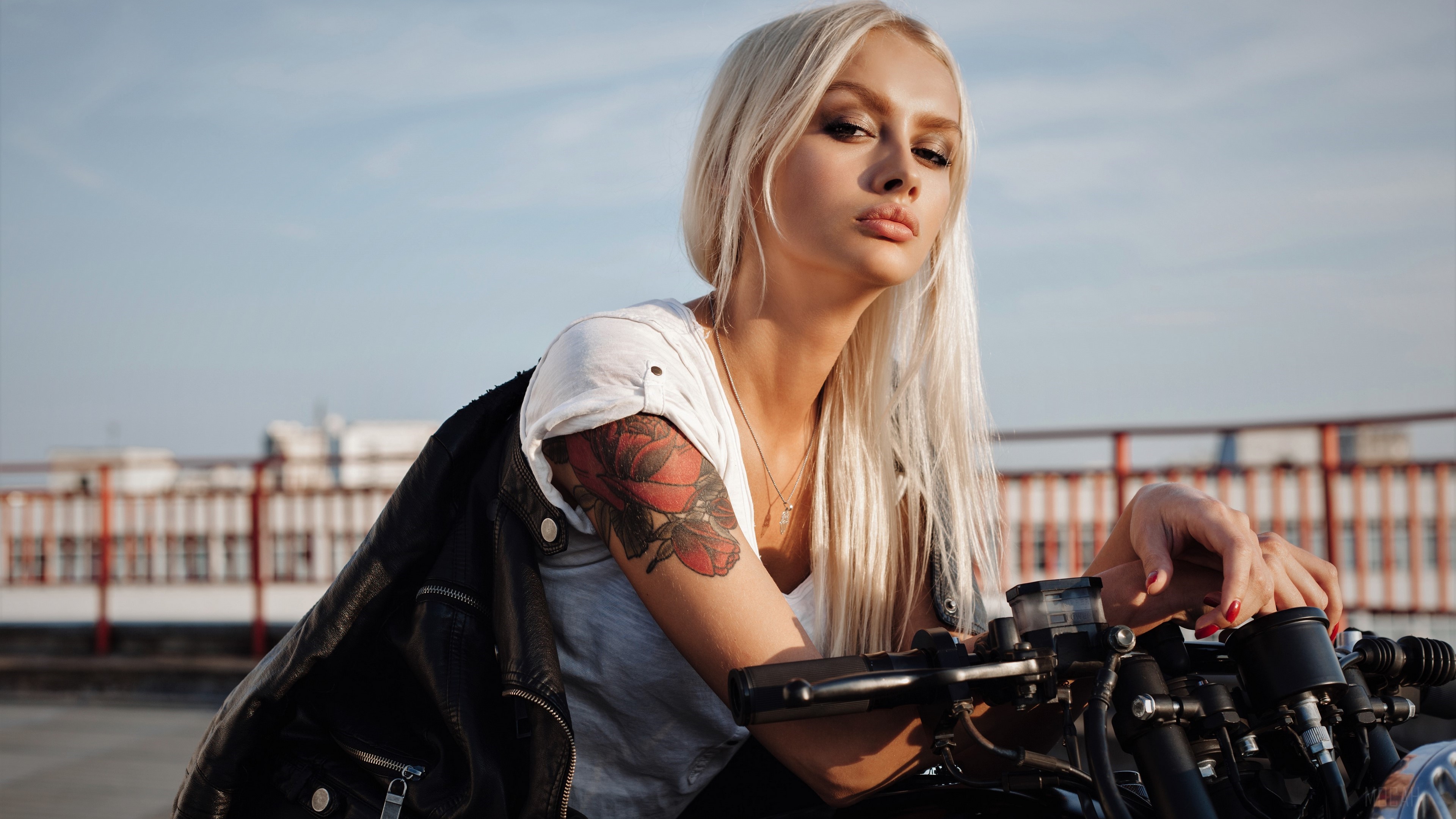 Blonde woman with tattoo on motorcycle 4K HD Wallpaper
