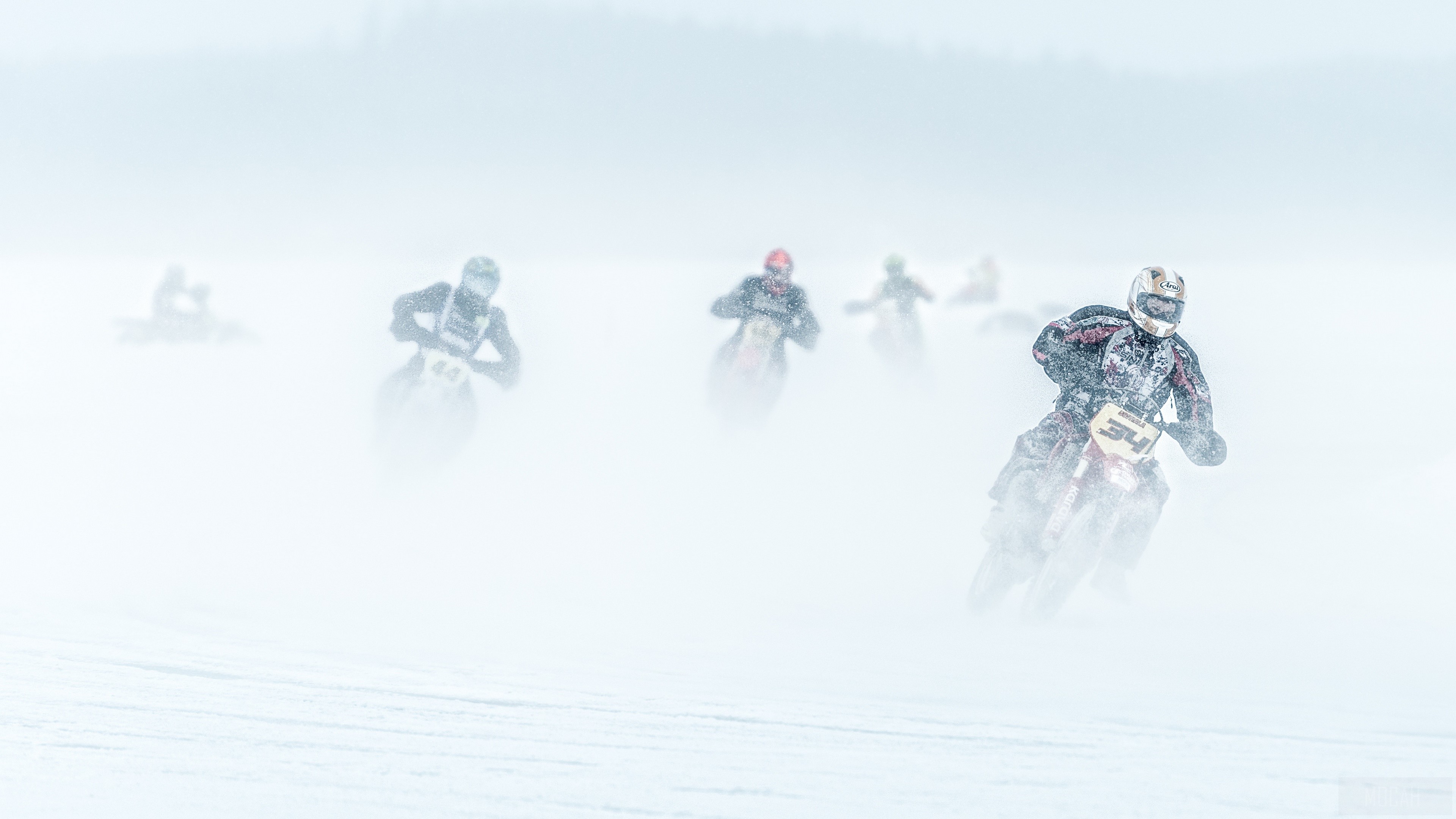 Motorcycle race in snowstorm 4K HD Wallpaper