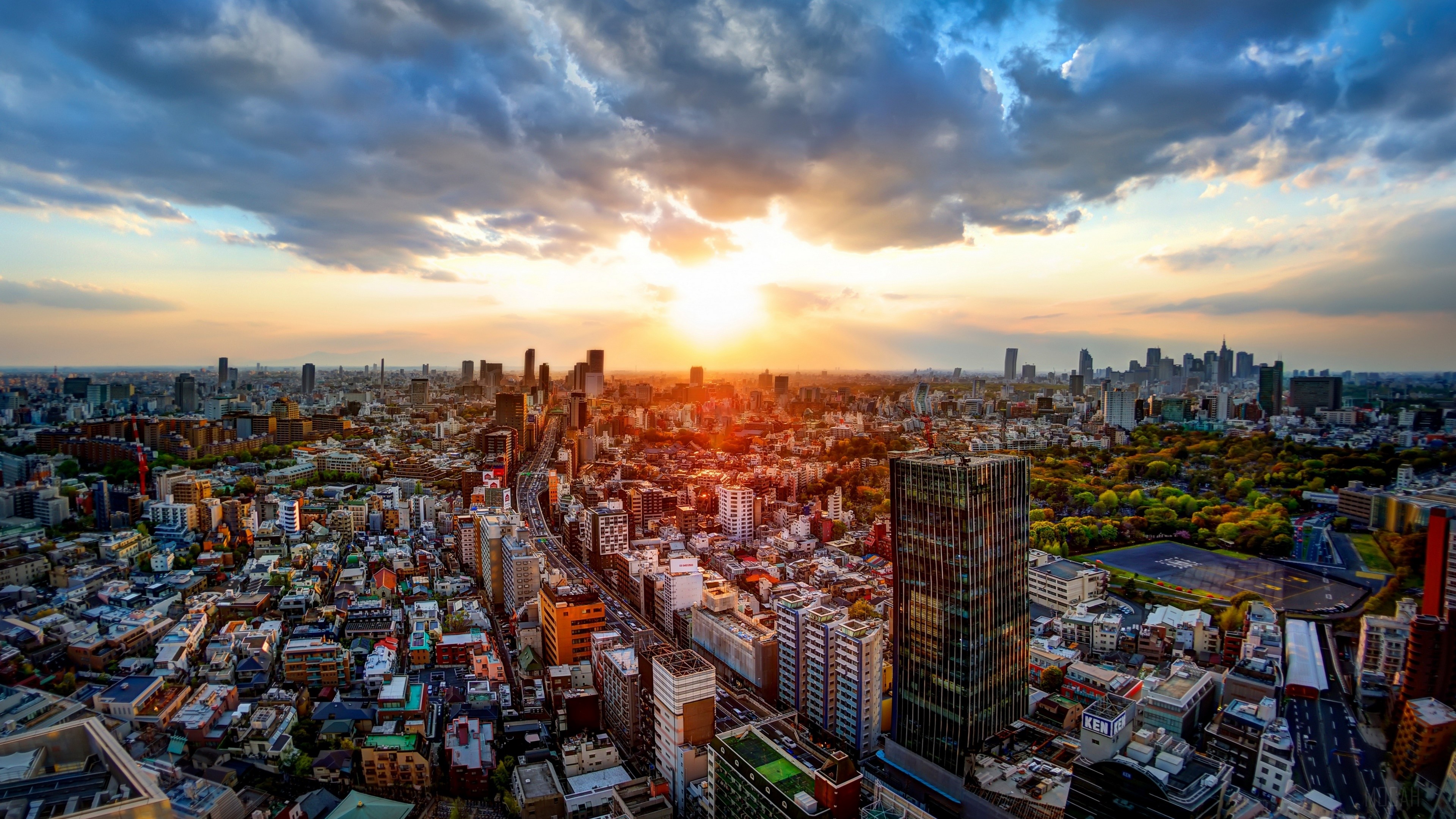 Tokyo cityscape at sunset with dramatic clouds HD Wallpaper