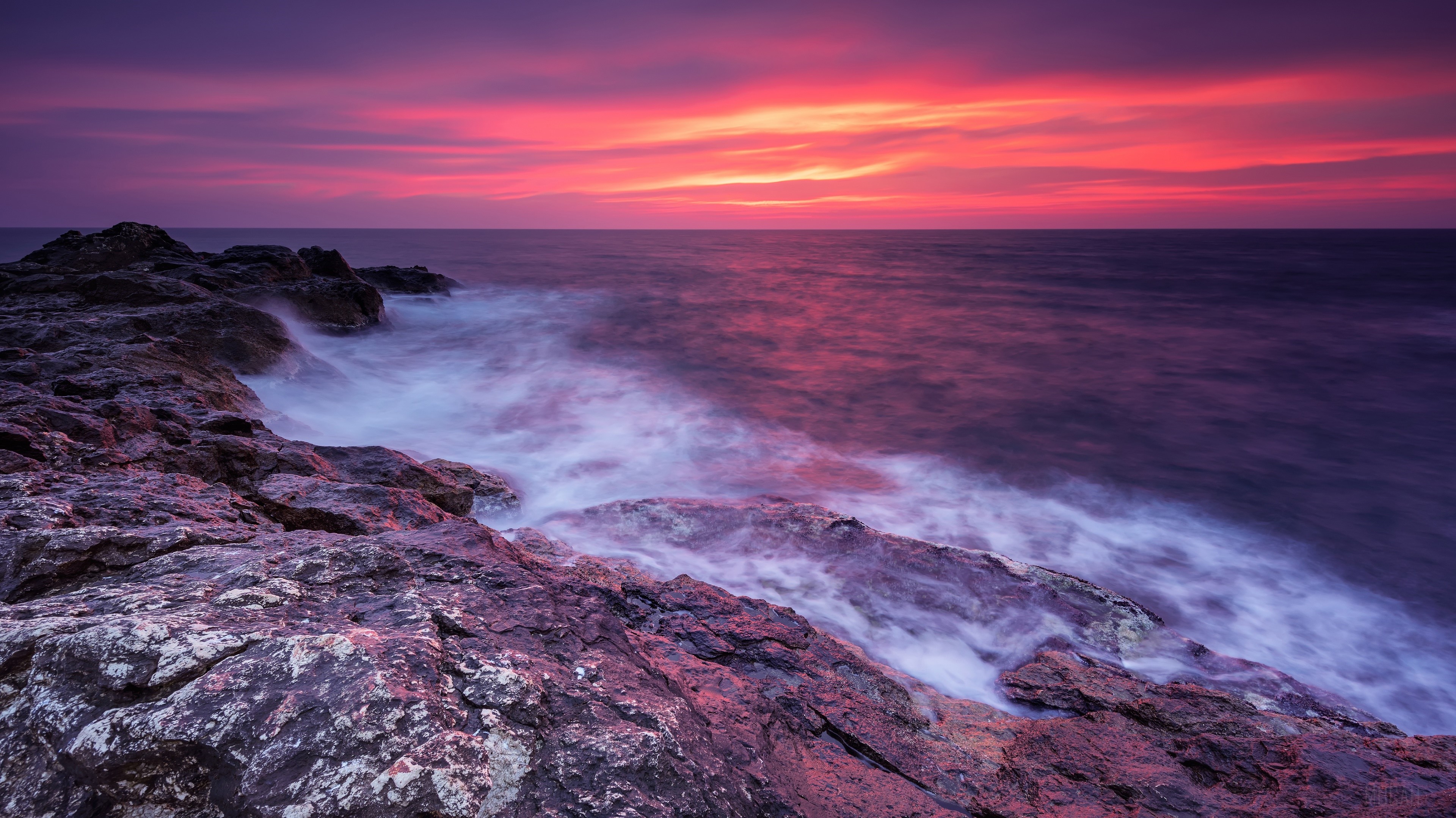 Ocean sunset with rocky shore 4K HD Wallpaper