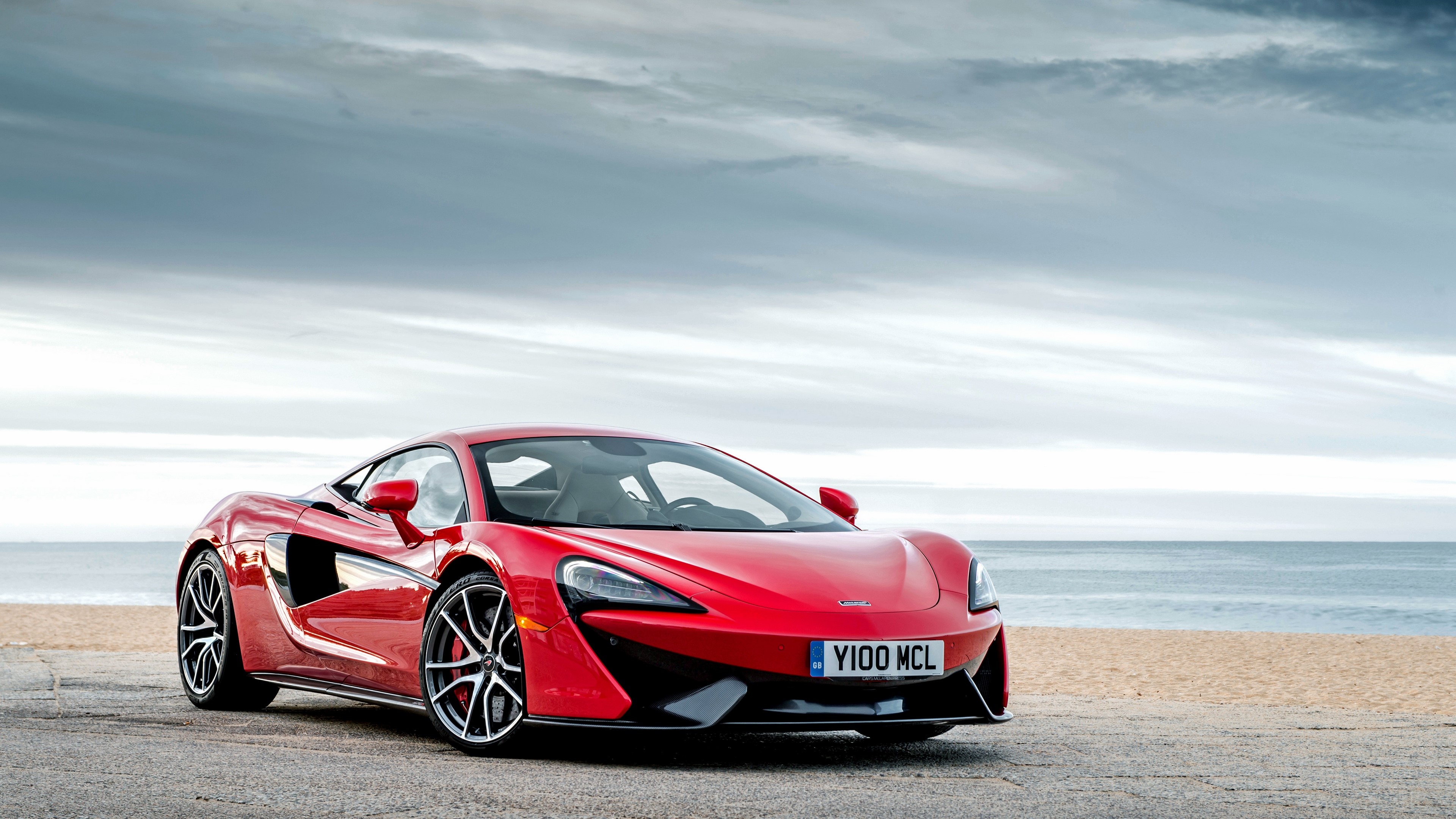 Red McLaren 570S Supercar on Seaside Road 4K HD Wallpaper