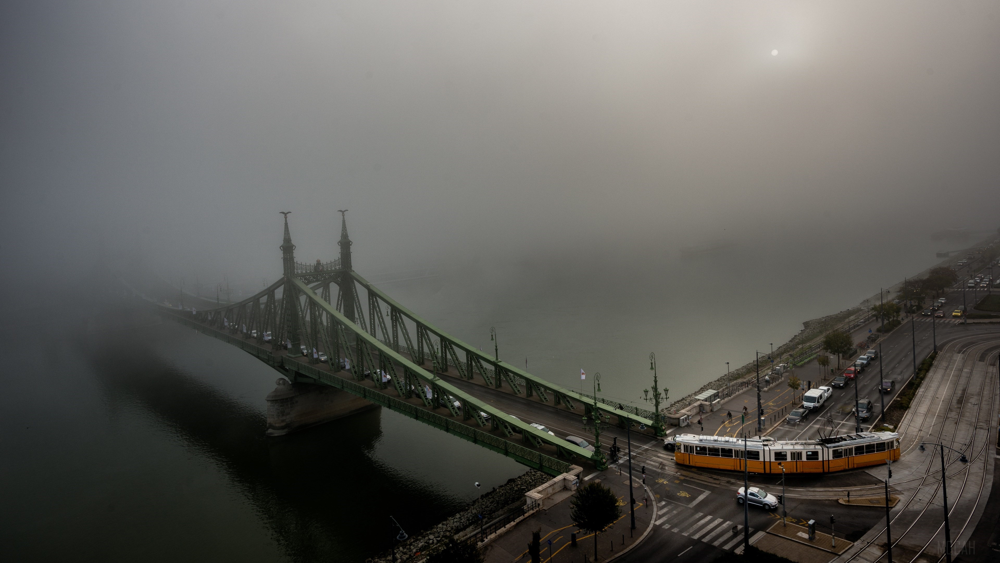 Foggy Danube River with Liberty Bridge and Tram in Budapest 4K HD Wallpaper
