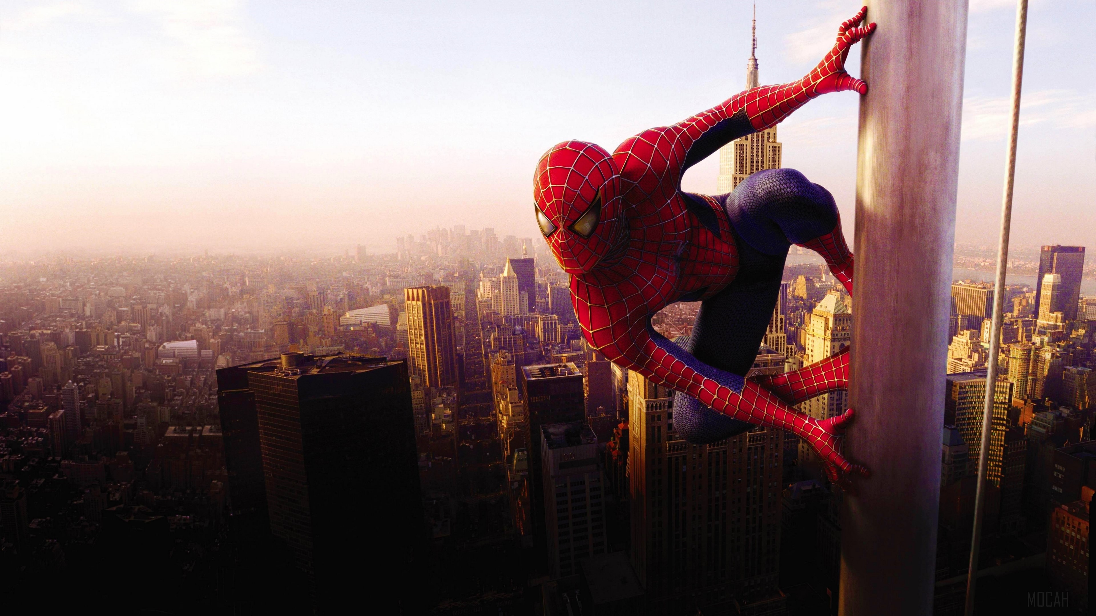 Spider-Man climbing a pole in New York City 4K HD Wallpaper