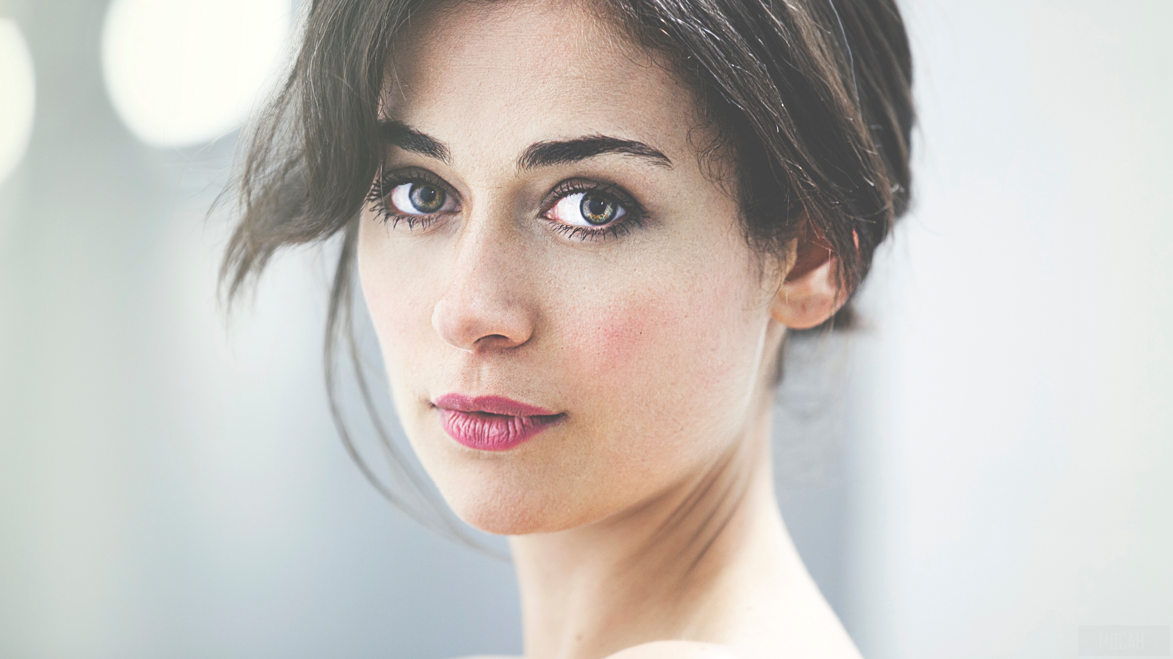 Portrait of a Brunette Woman with Intense Gaze 4K HD Wallpaper