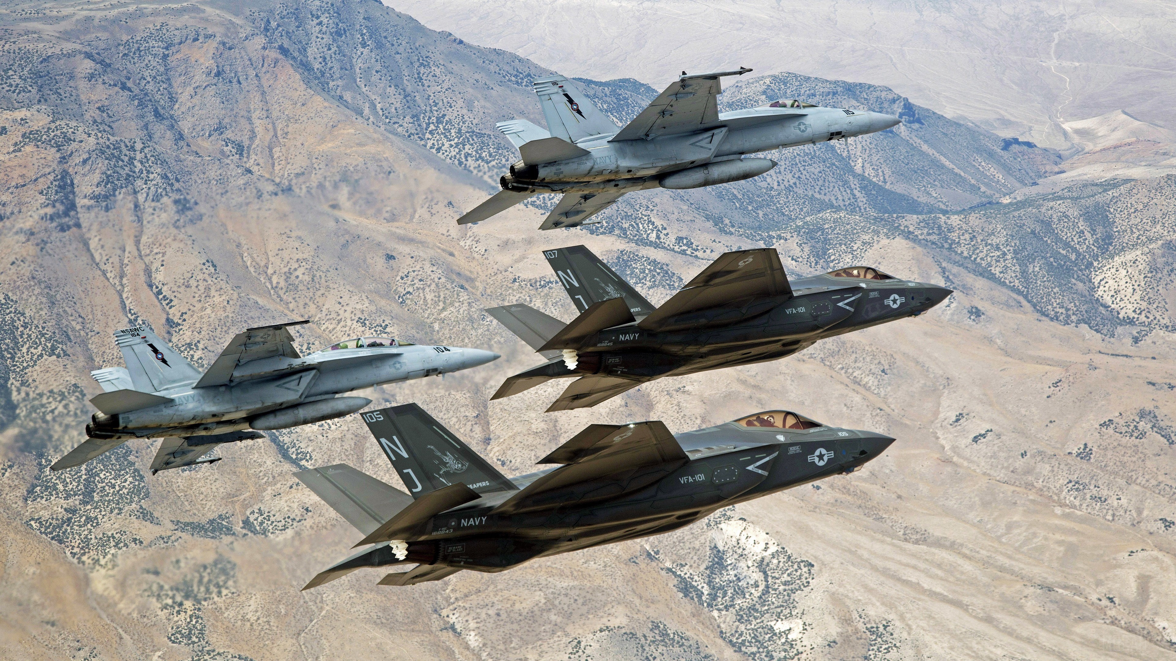 US Navy F/A-18E/F Super Hornets and F-35C Lightning IIs in formation HD Wallpaper