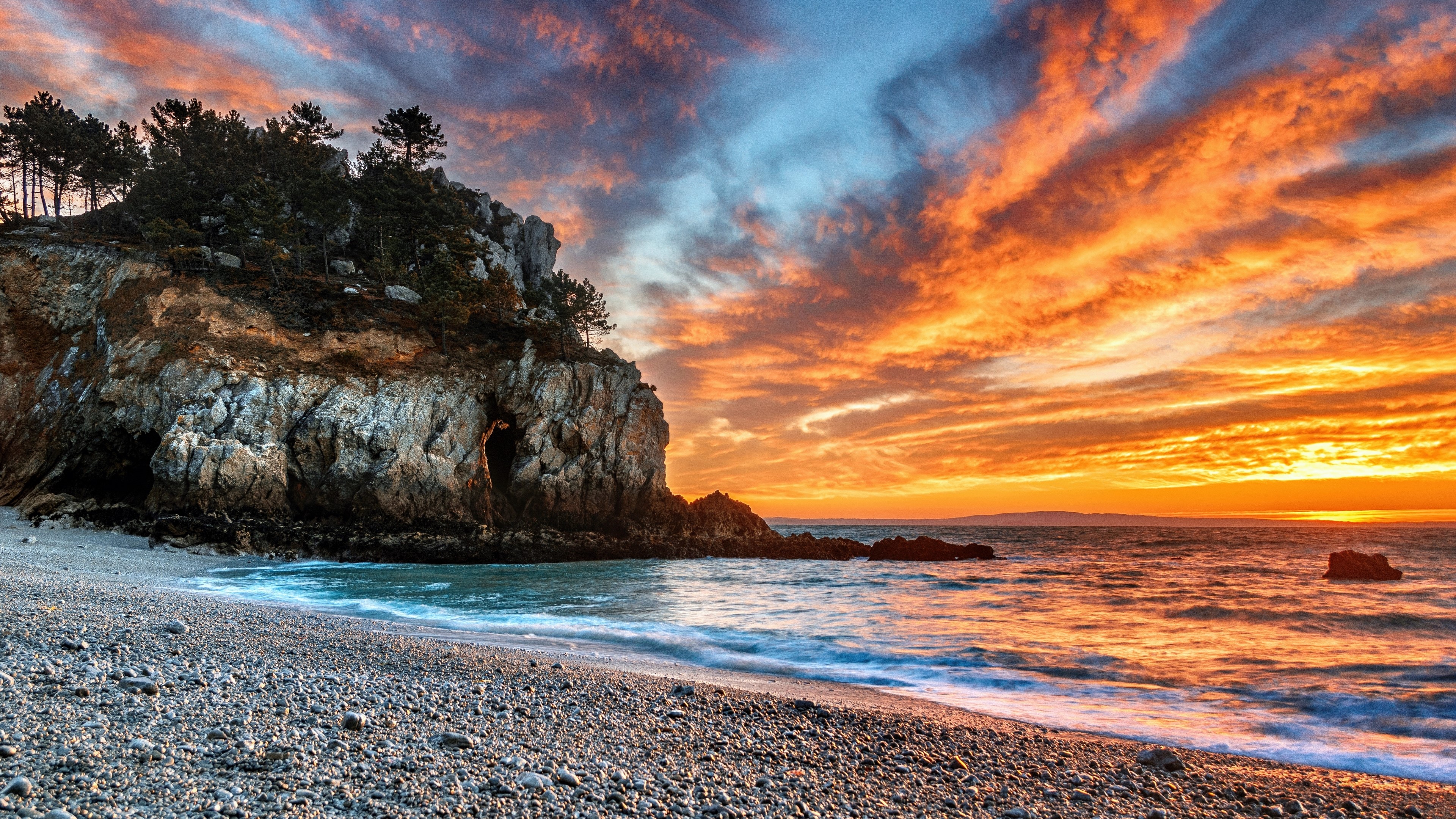 Beach with Rocky Outcrop at Sunset 4K HD Wallpaper
