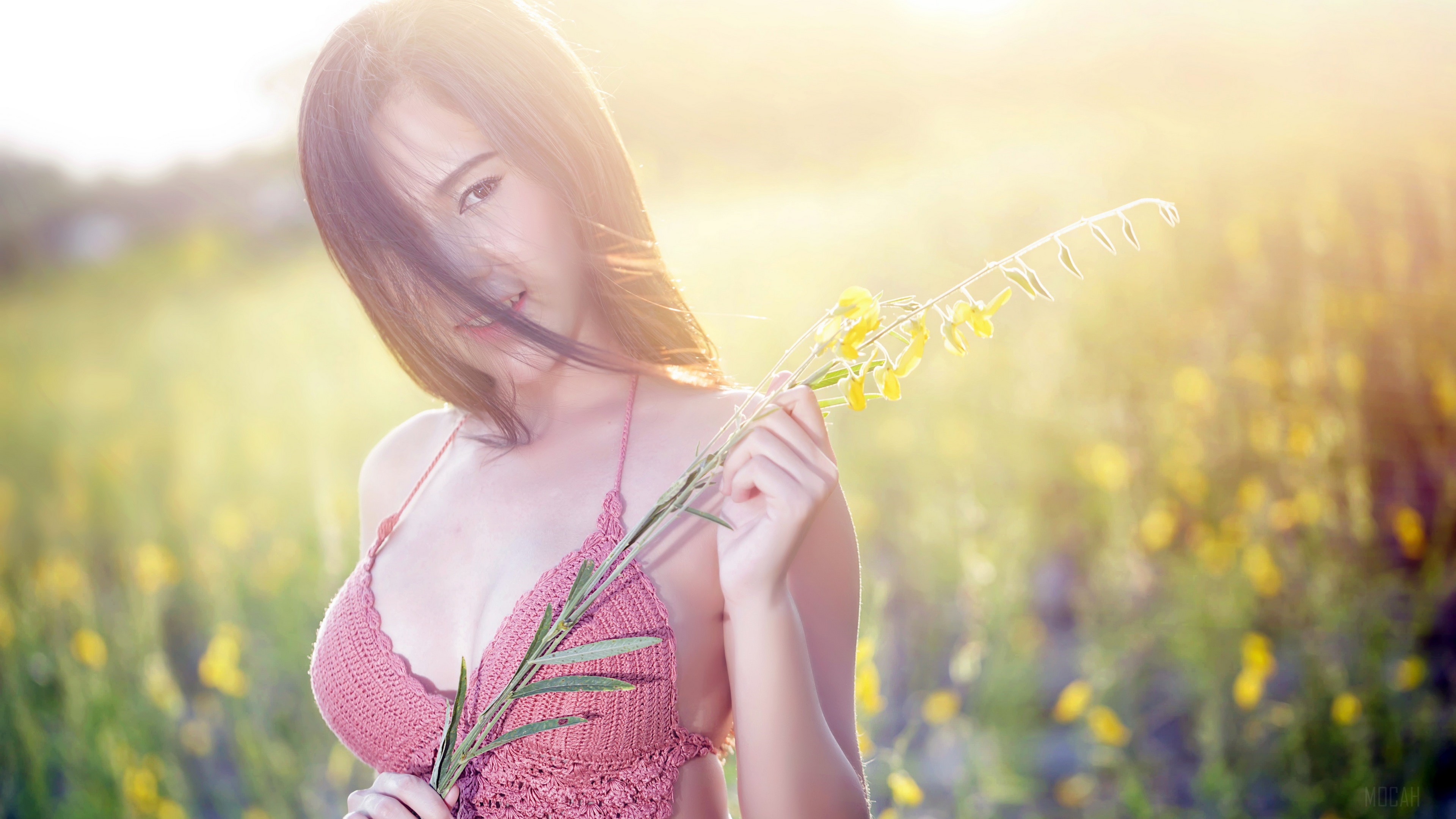 Woman with Yellow Flowers in Field 4K HD Wallpaper