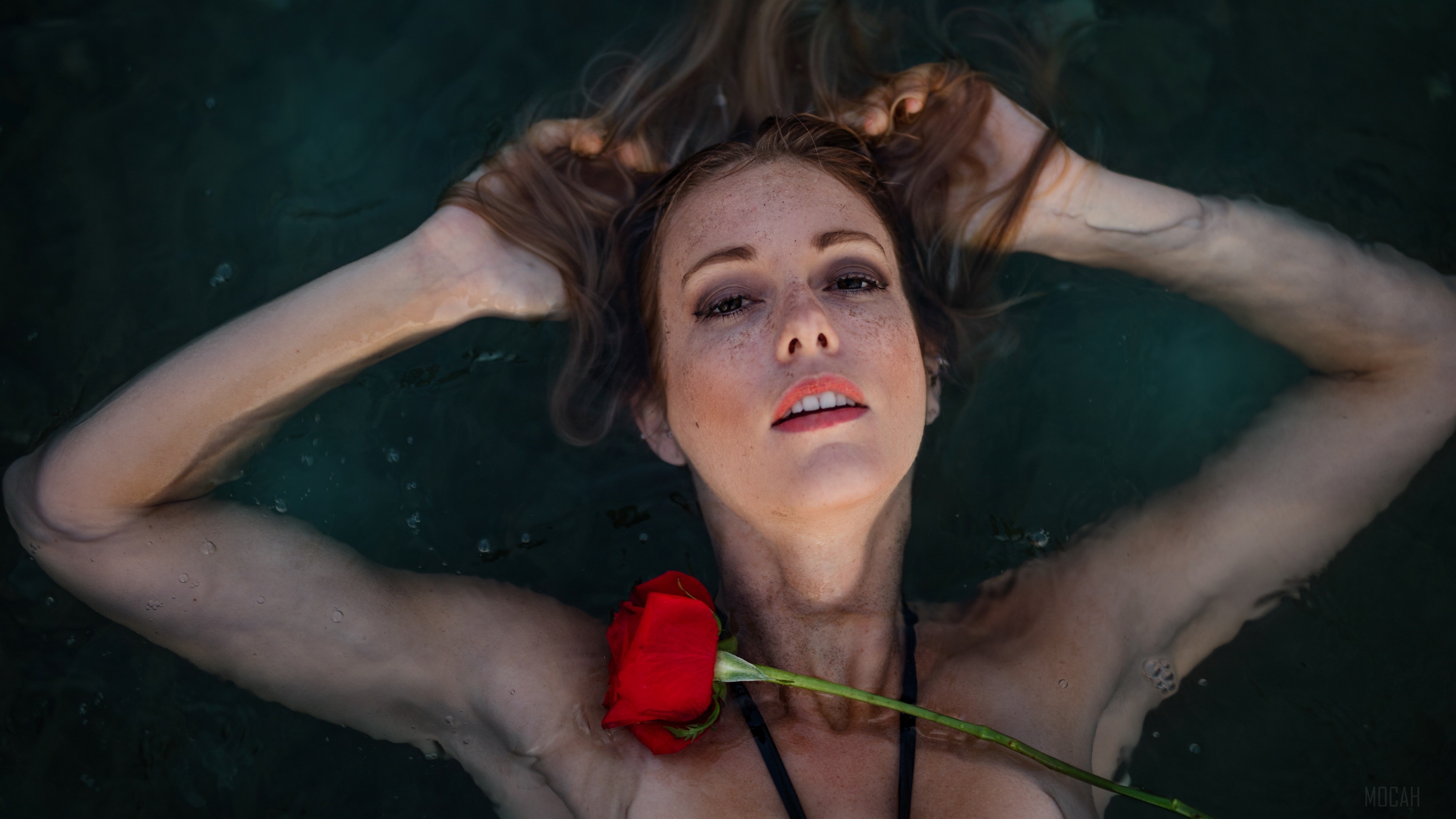 Freckled Brunette Woman with Red Rose in Water 4K HD Wallpaper