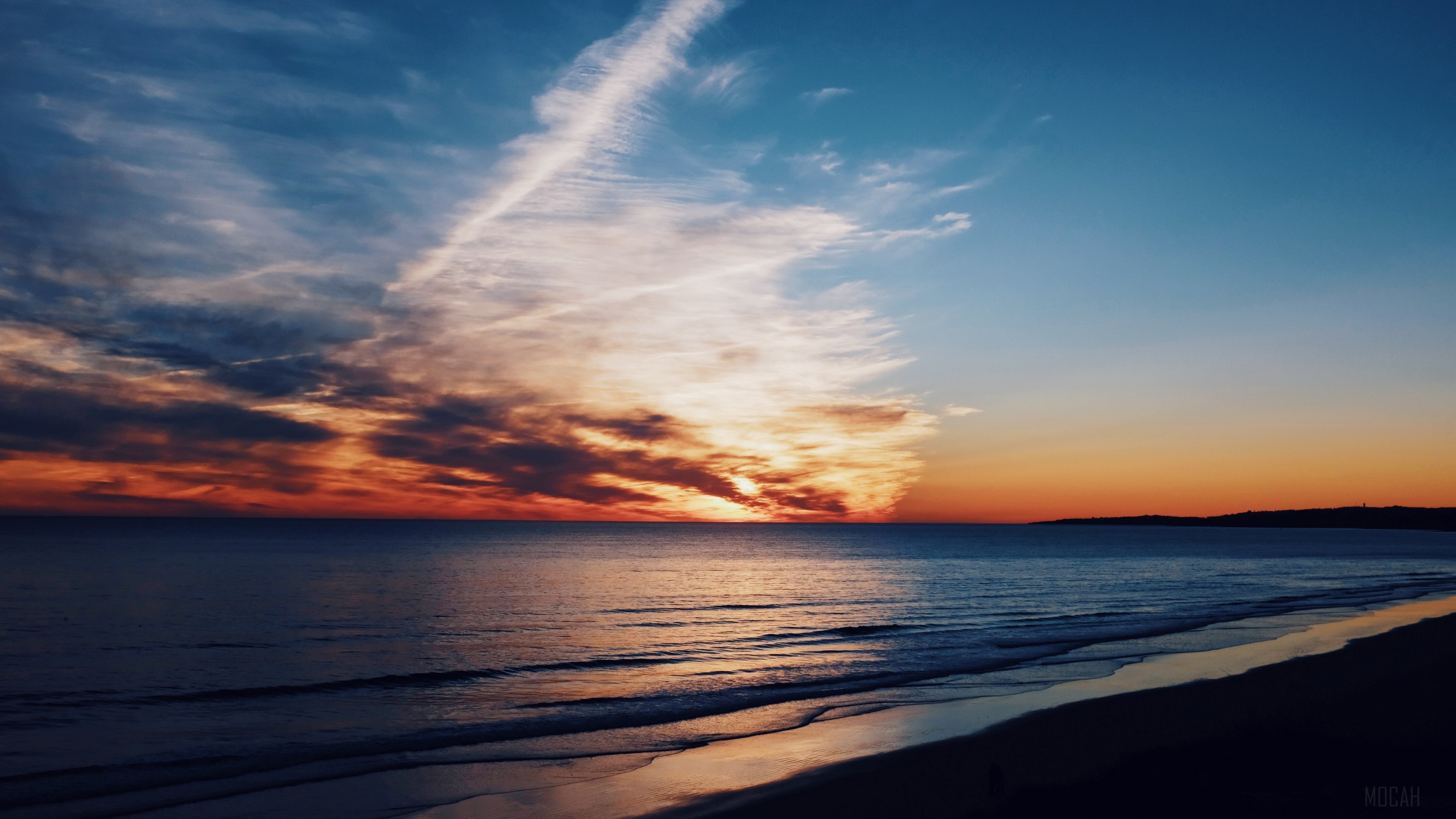 Sunset over the ocean with dramatic clouds HD Wallpaper