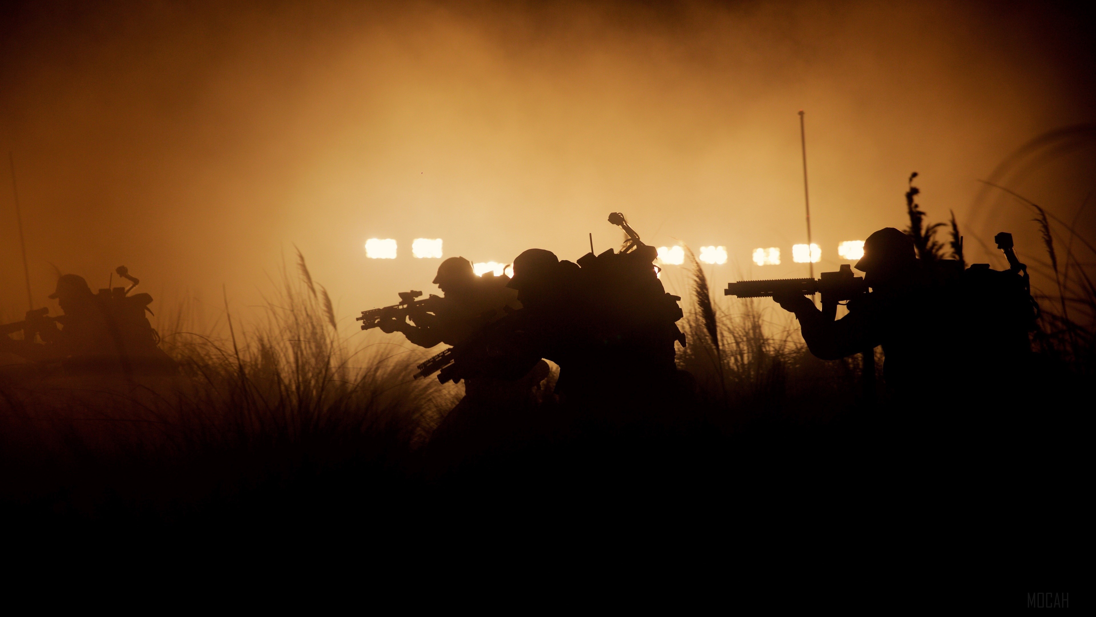 Soldiers in a foggy field with stadium lights HD Wallpaper