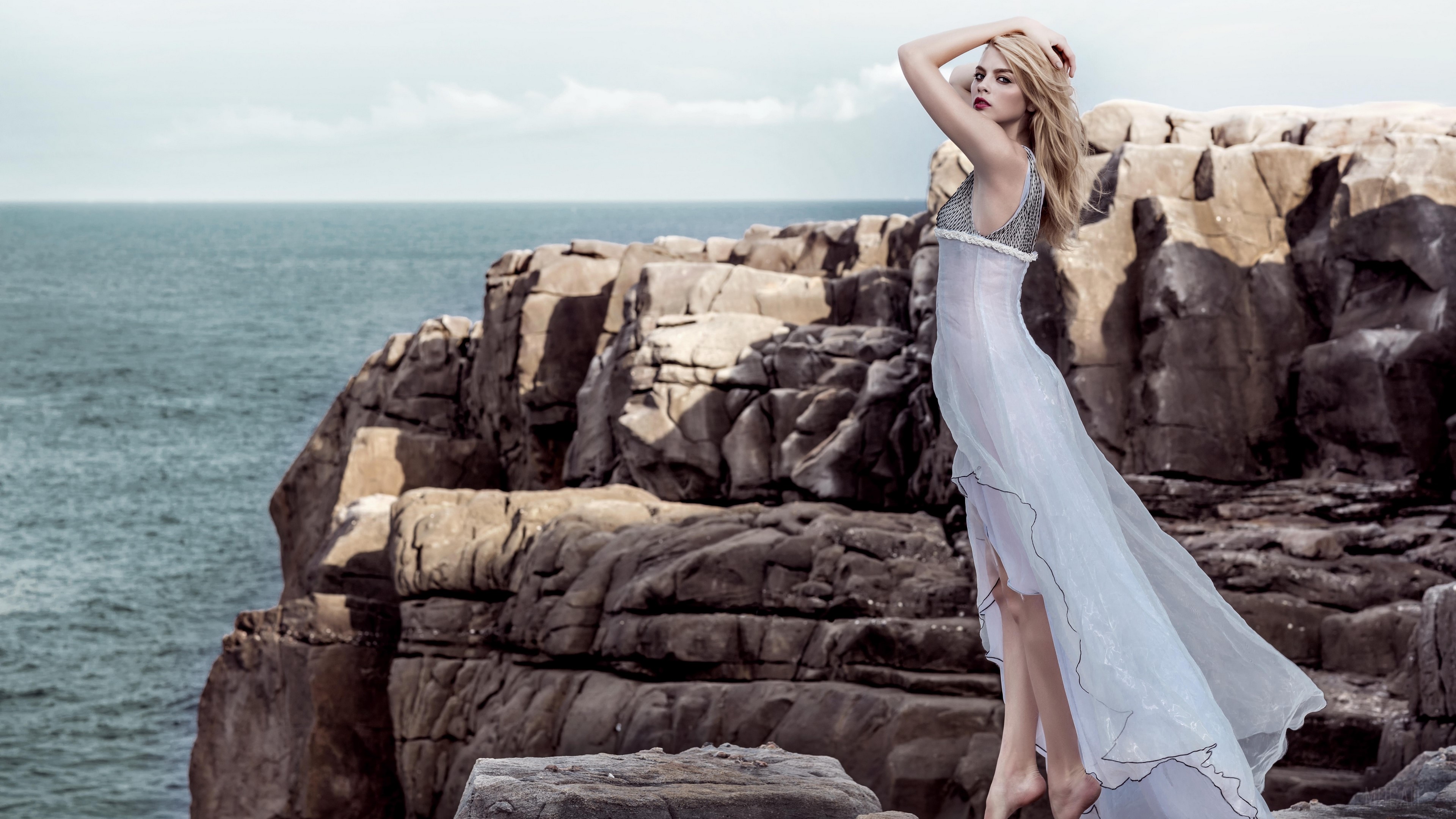 Blonde Woman in White Dress on Rocks 4K HD Wallpaper