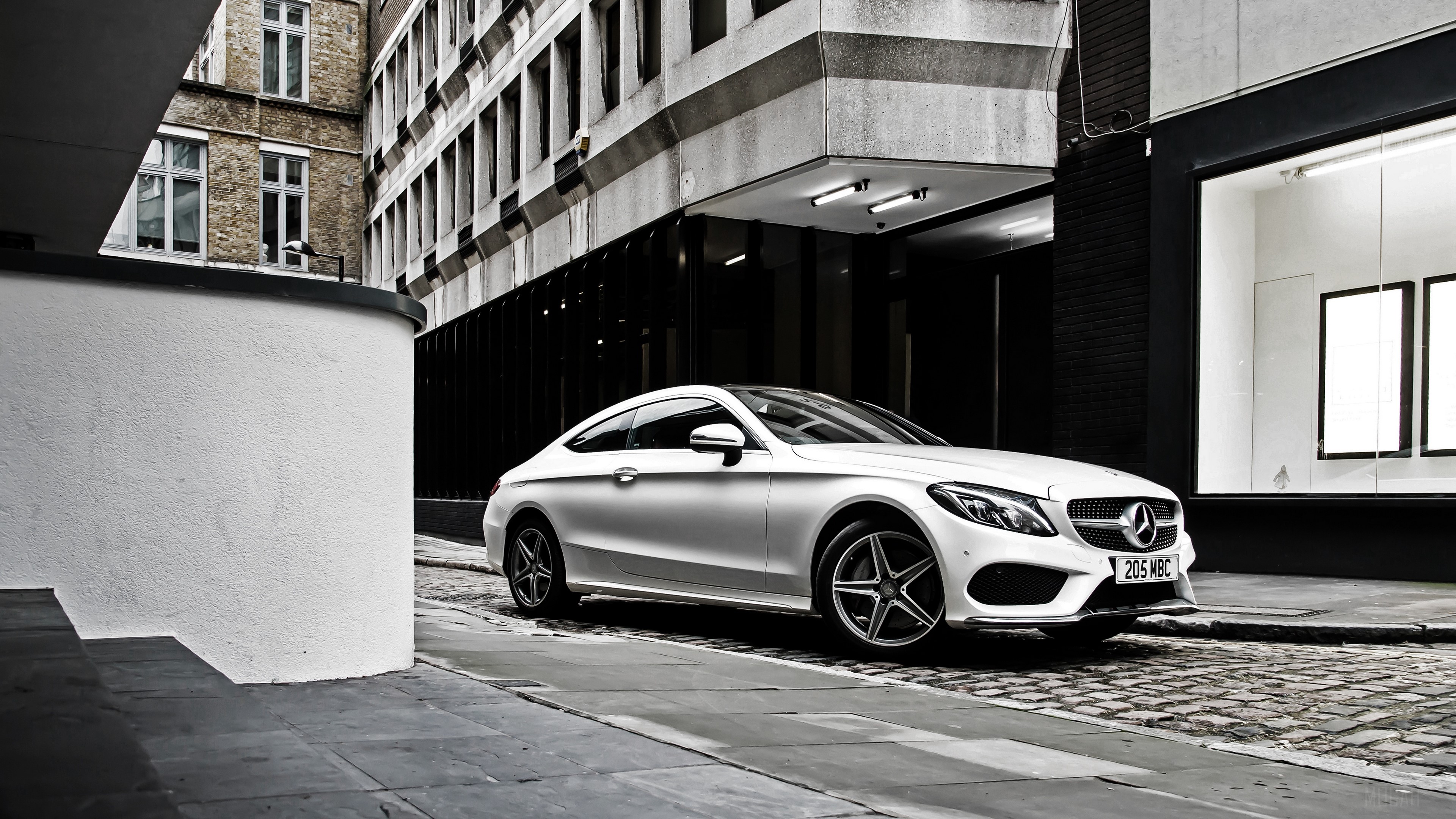 White Mercedes-Benz C-Class Coupe on Cobblestone Street HD Wallpaper