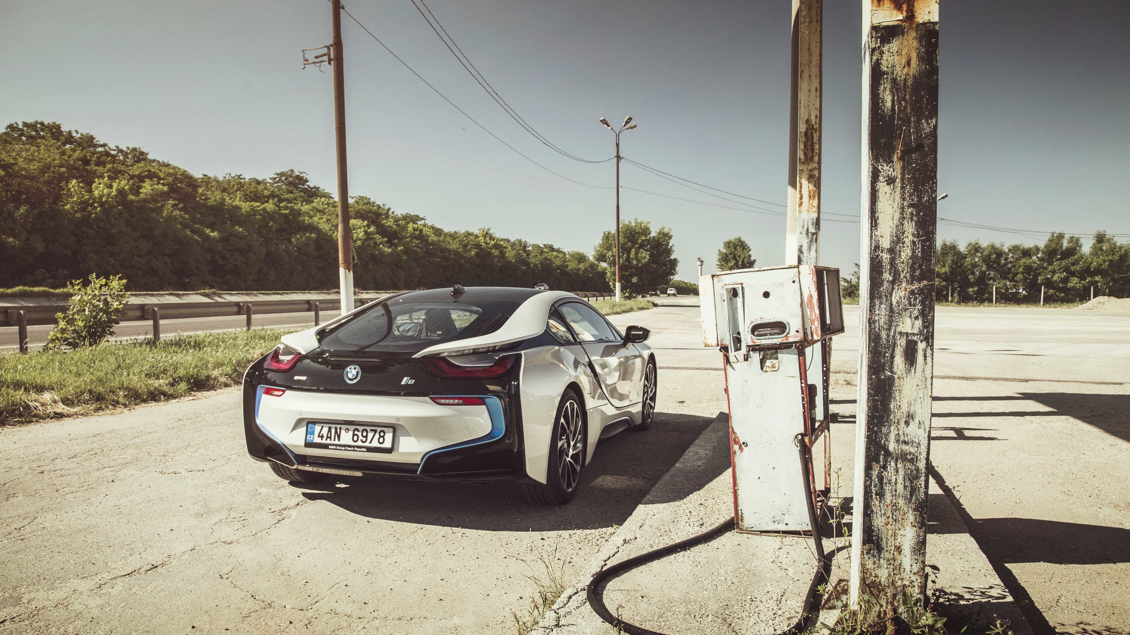 White BMW i8 at abandoned gas station HD Wallpaper