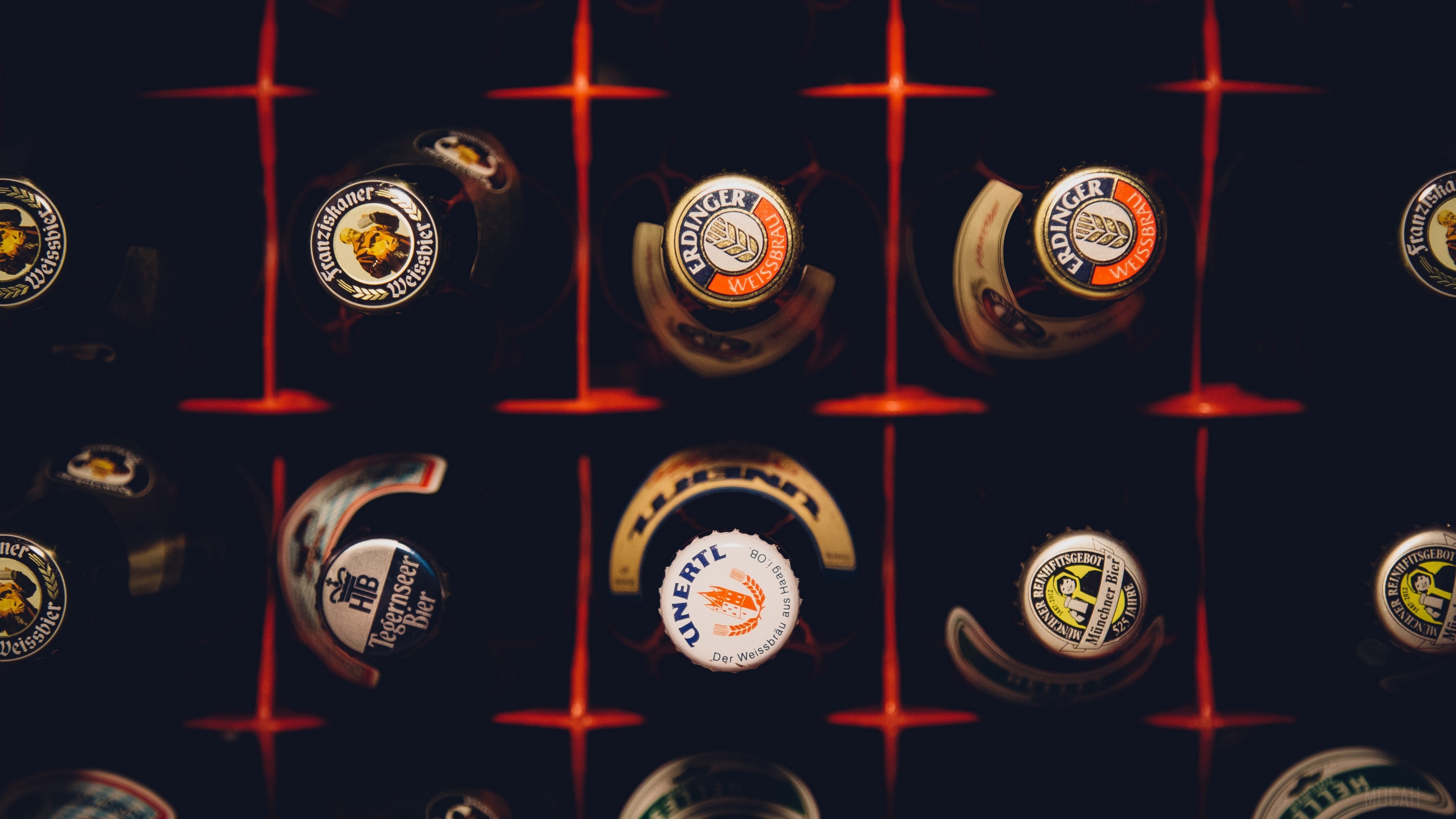 Beer bottle caps in a rack HD Wallpaper