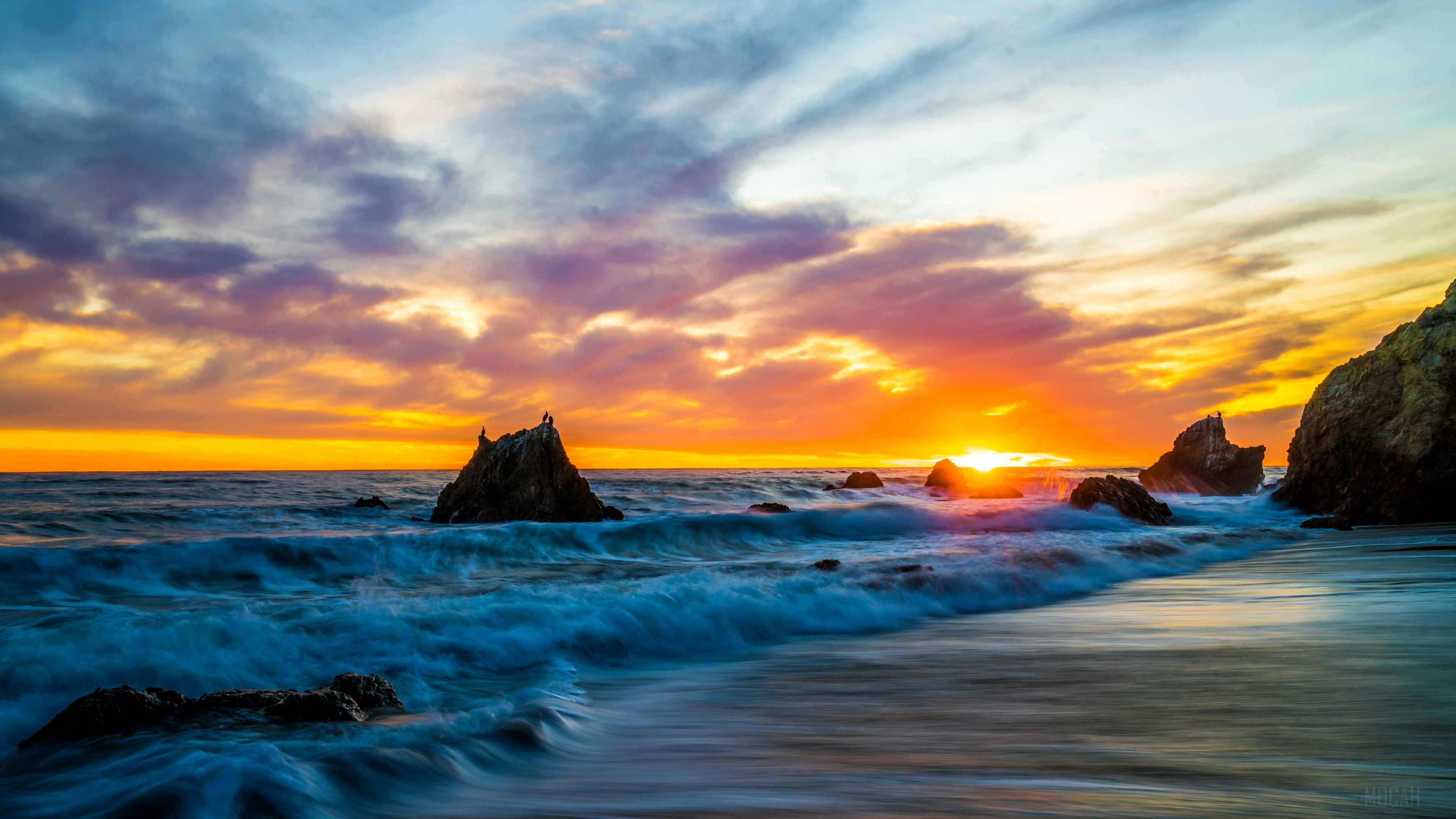 Sunset over the ocean with waves and rocks 4K HD Wallpaper