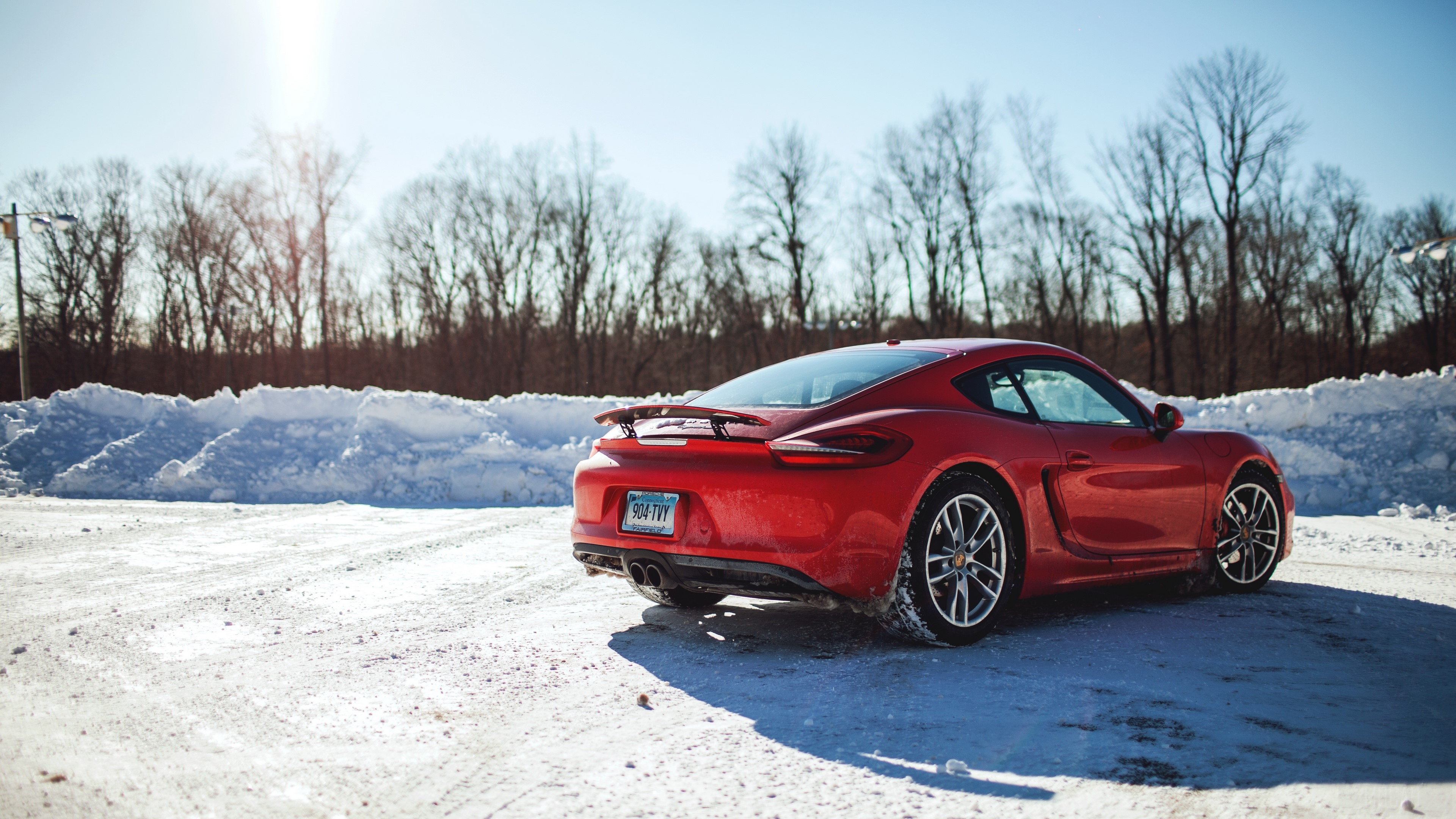 Red Porsche Cayman S in Snow 4K HD Wallpaper
