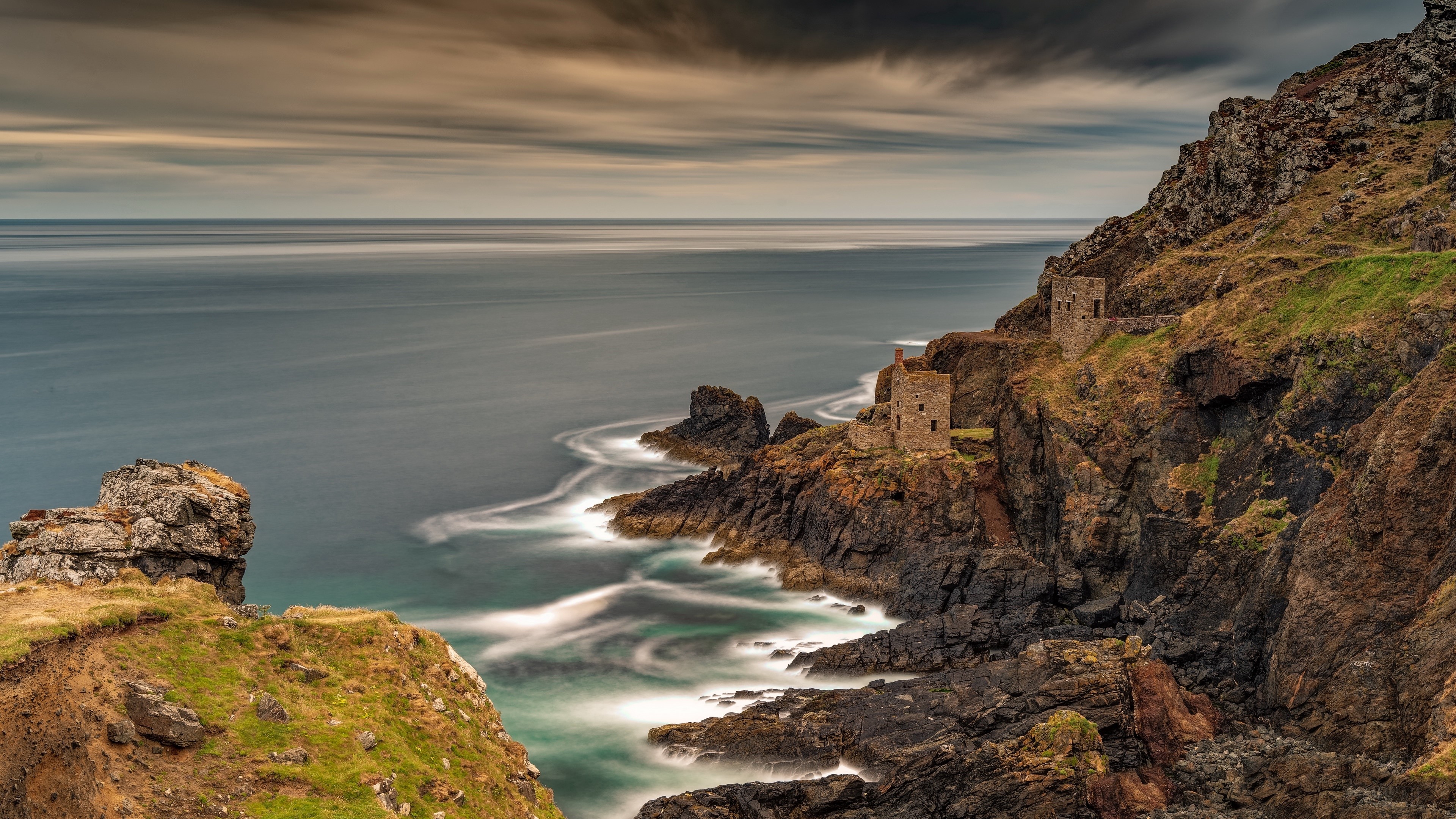 Ruined buildings on a rocky coast overlooking the sea HD Wallpaper