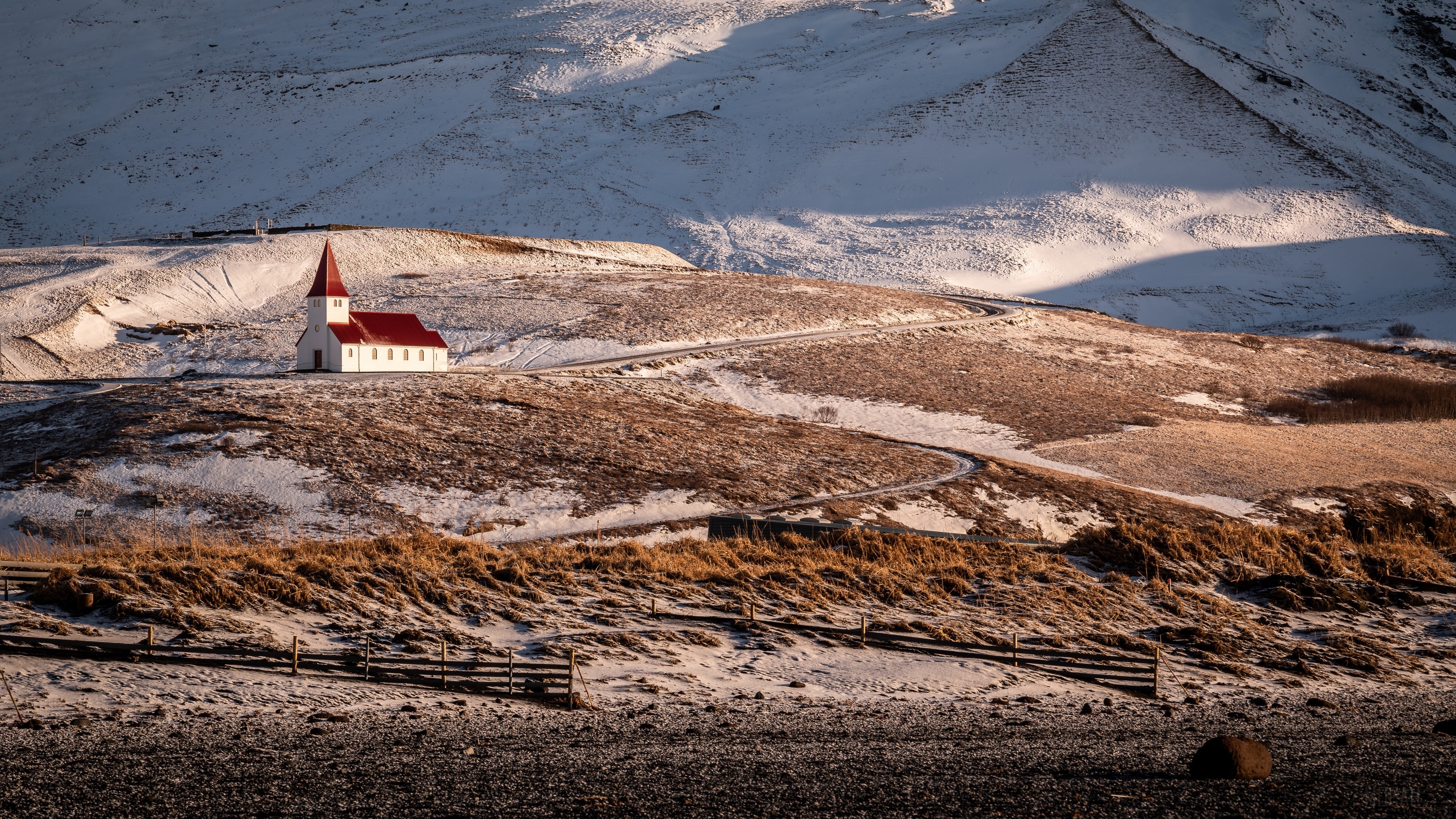 White church with red roof in snowy Iceland landscape 4K HD Wallpaper