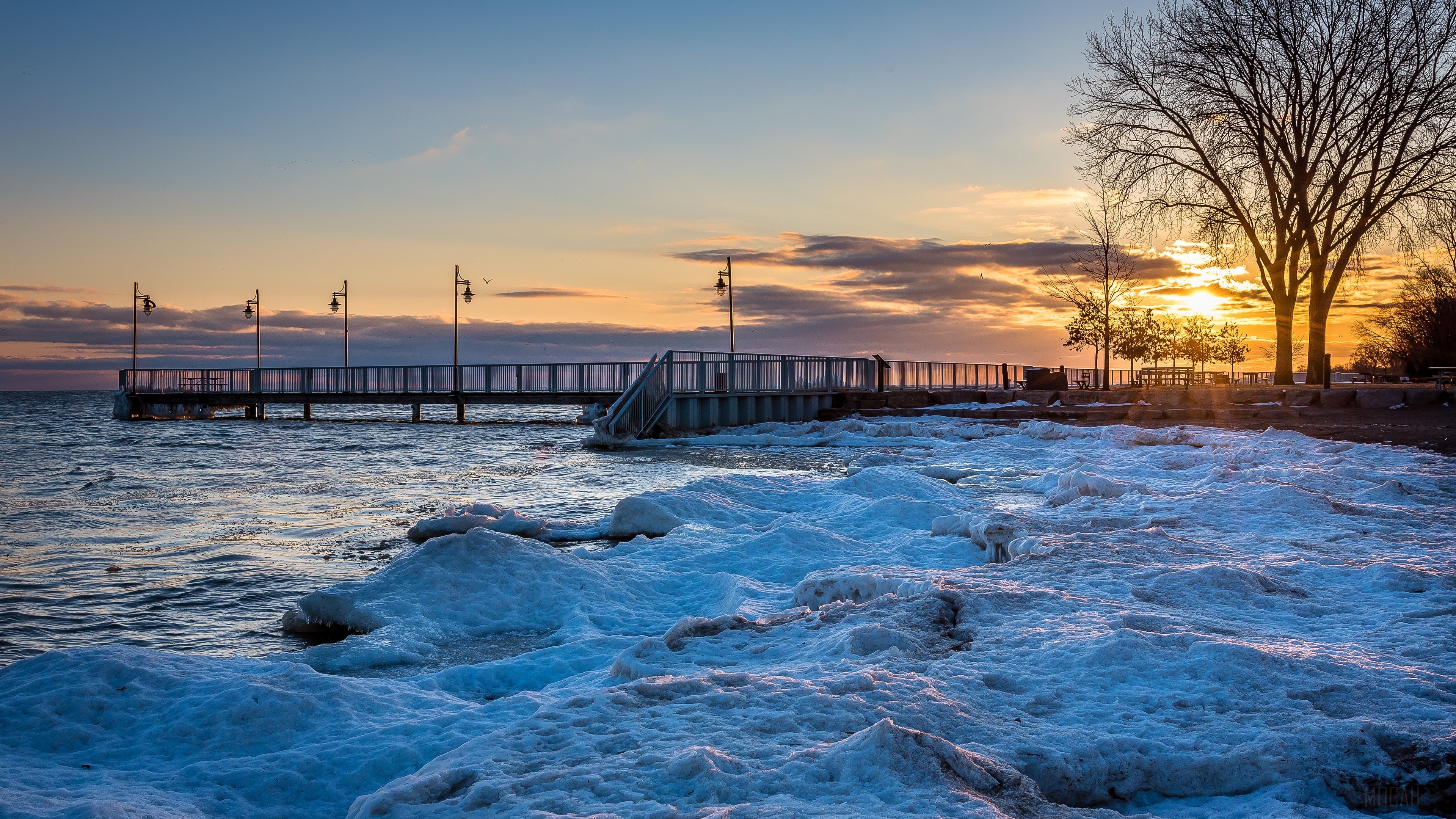 Pier and icy shore at sunset in Ontario, Canada 4K HD Wallpaper