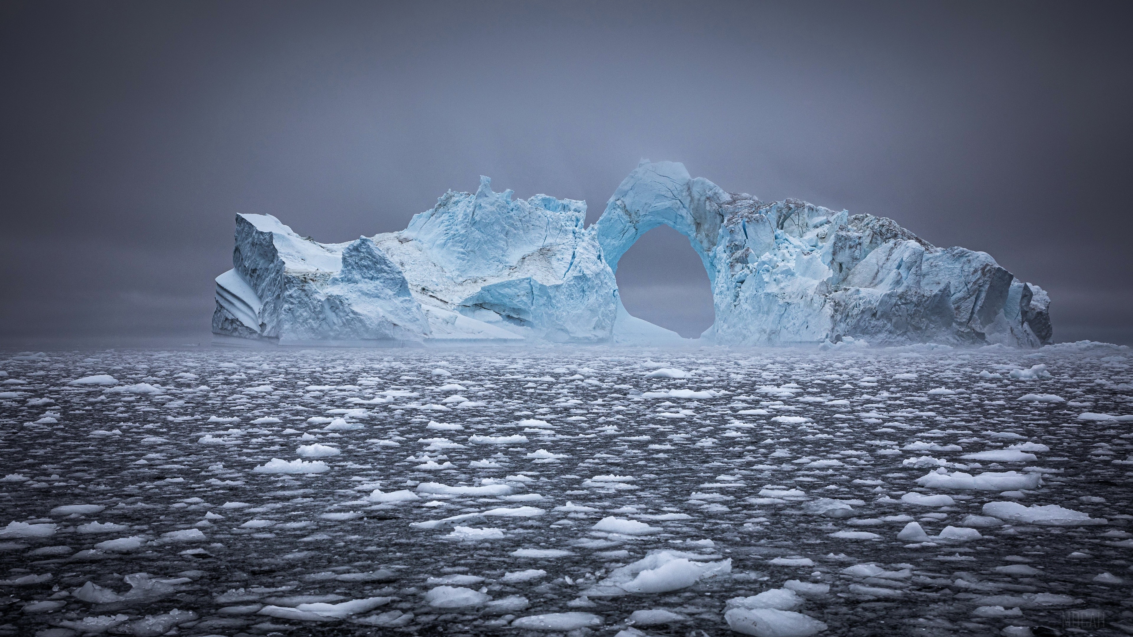 Iceberg with a hole in the ocean HD Wallpaper