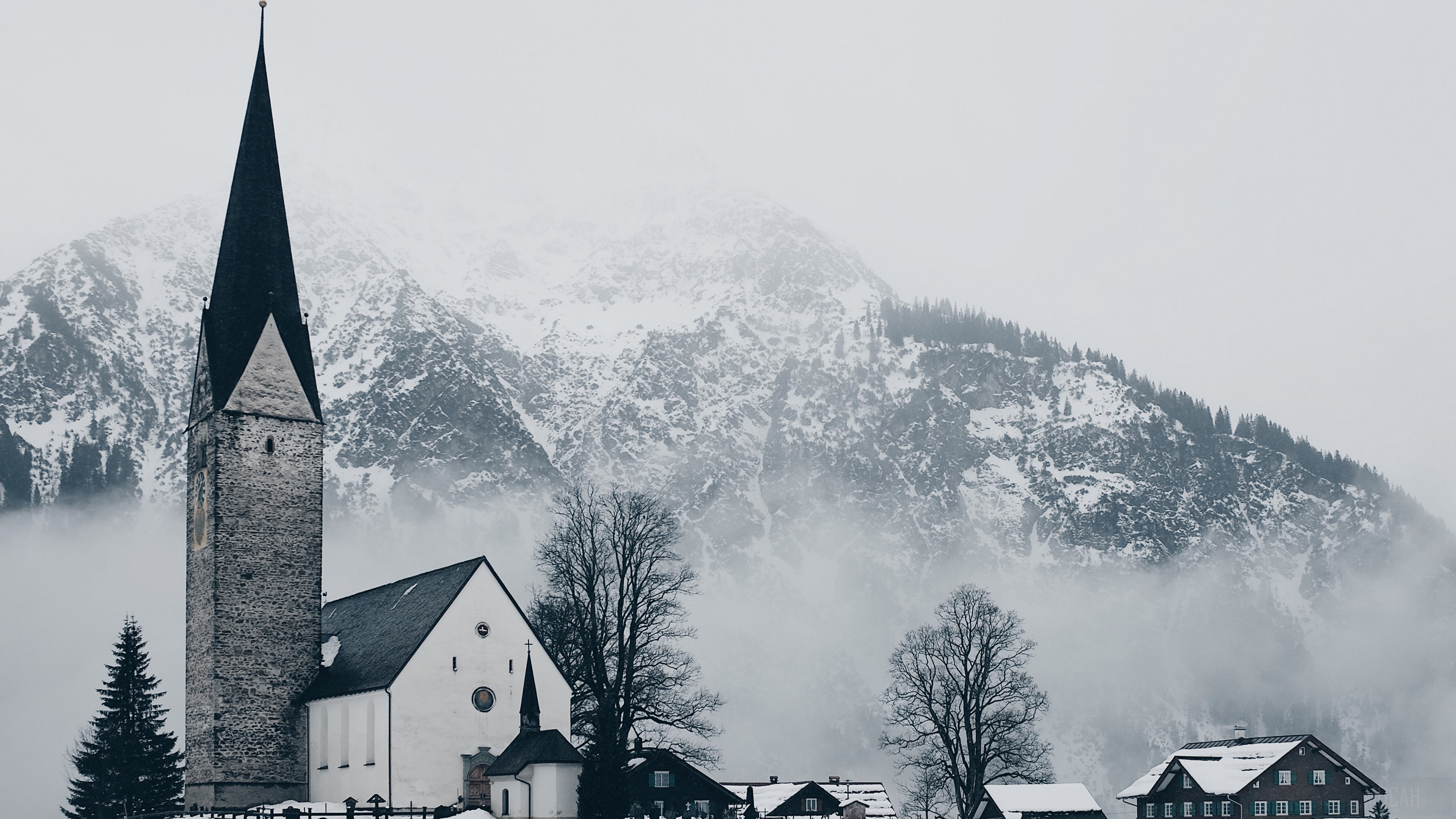 Church in a Snowy Village with Mountains HD Wallpaper