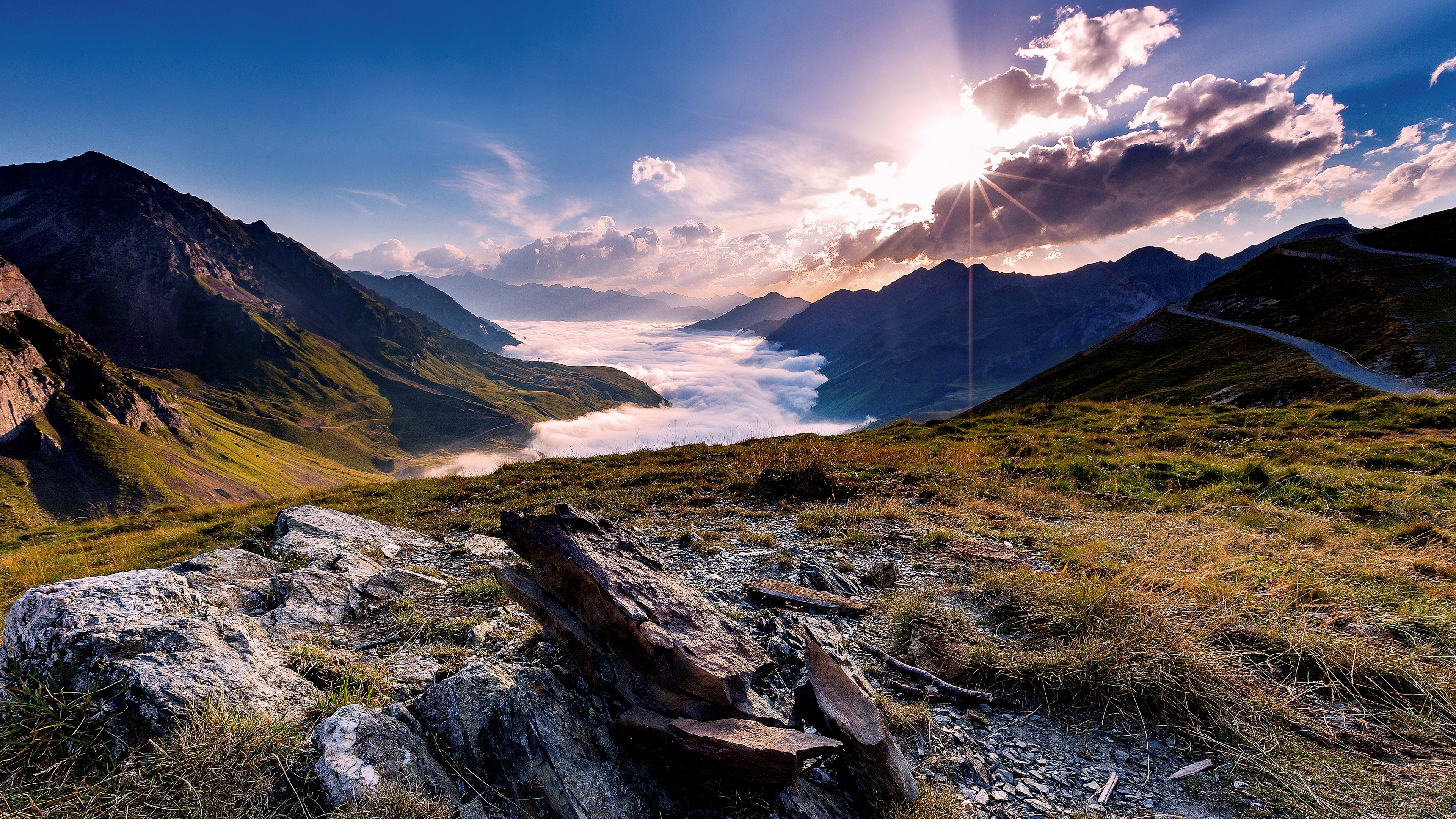 Mountain landscape with clouds and sun rays HD Wallpaper