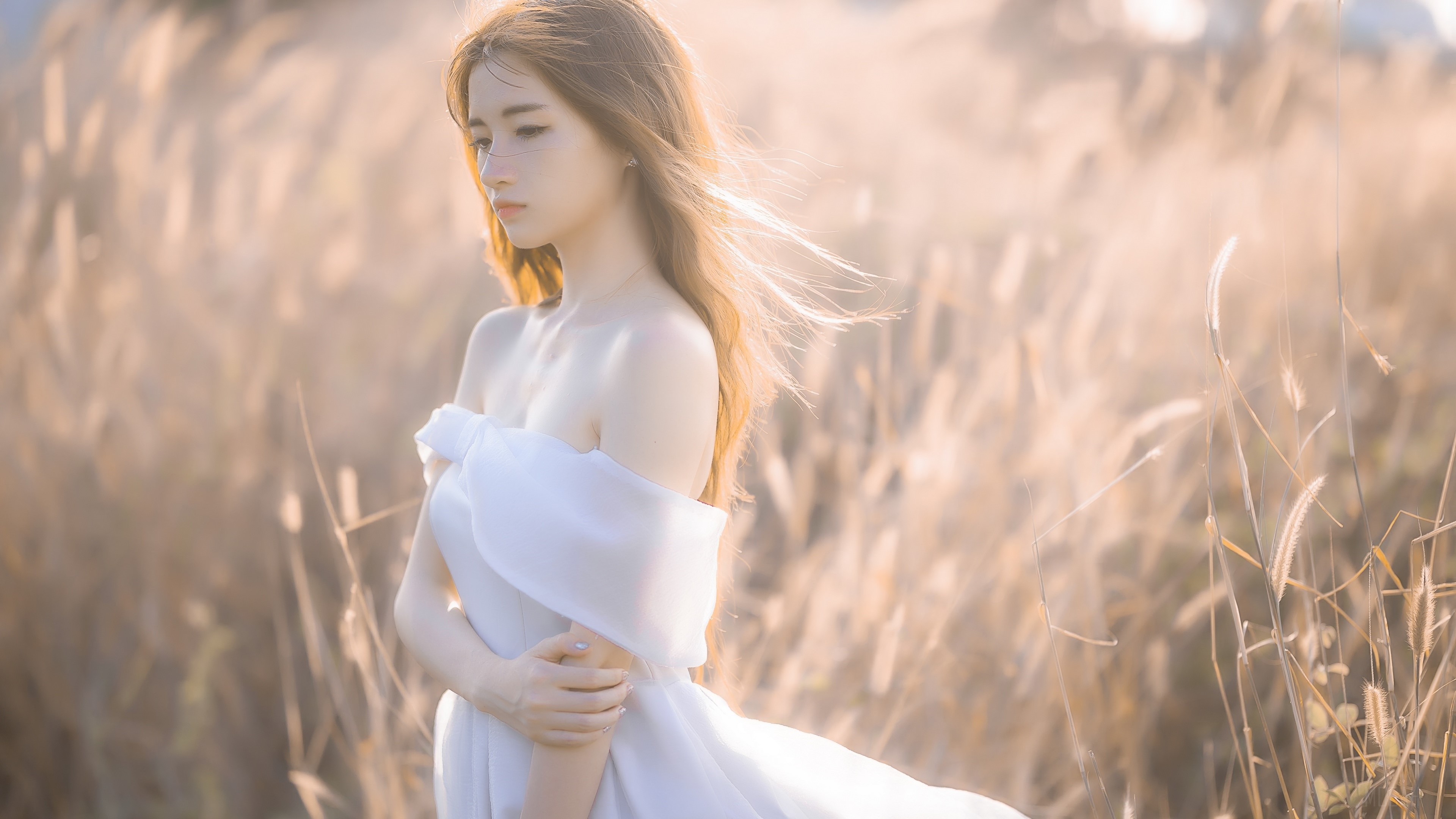 Serene Woman in White Dress Amid Golden Field 4K HD Wallpaper