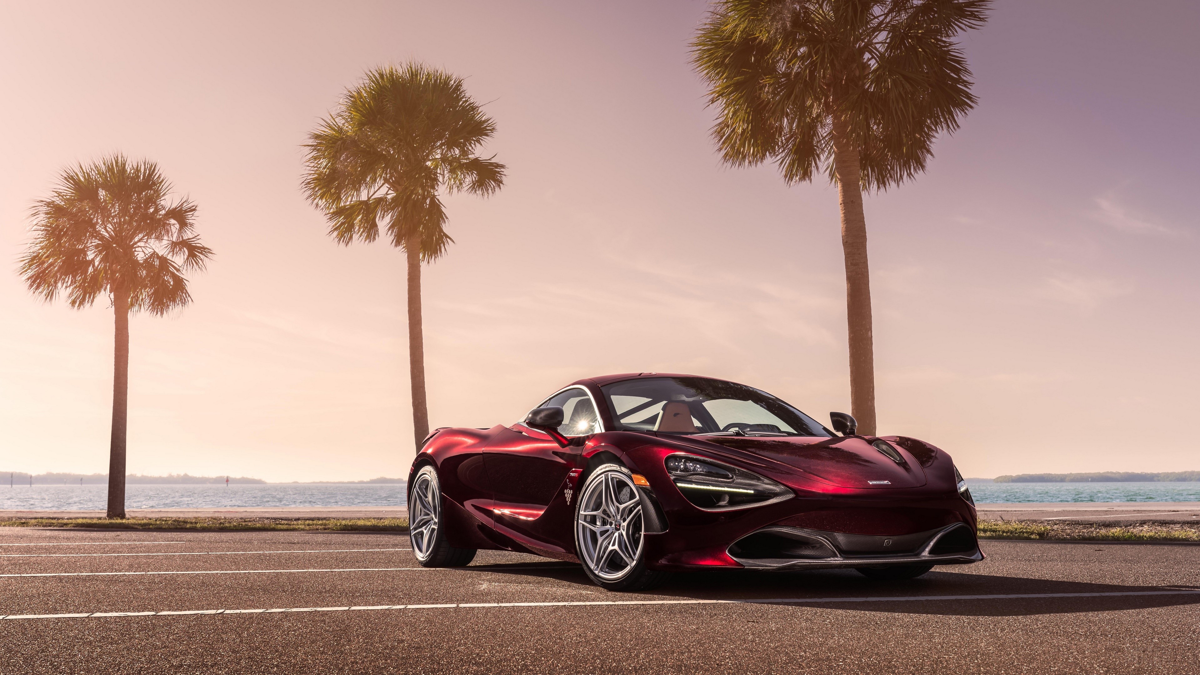 Red McLaren 720S Supercar parked by the ocean with palm trees HD Wallpaper