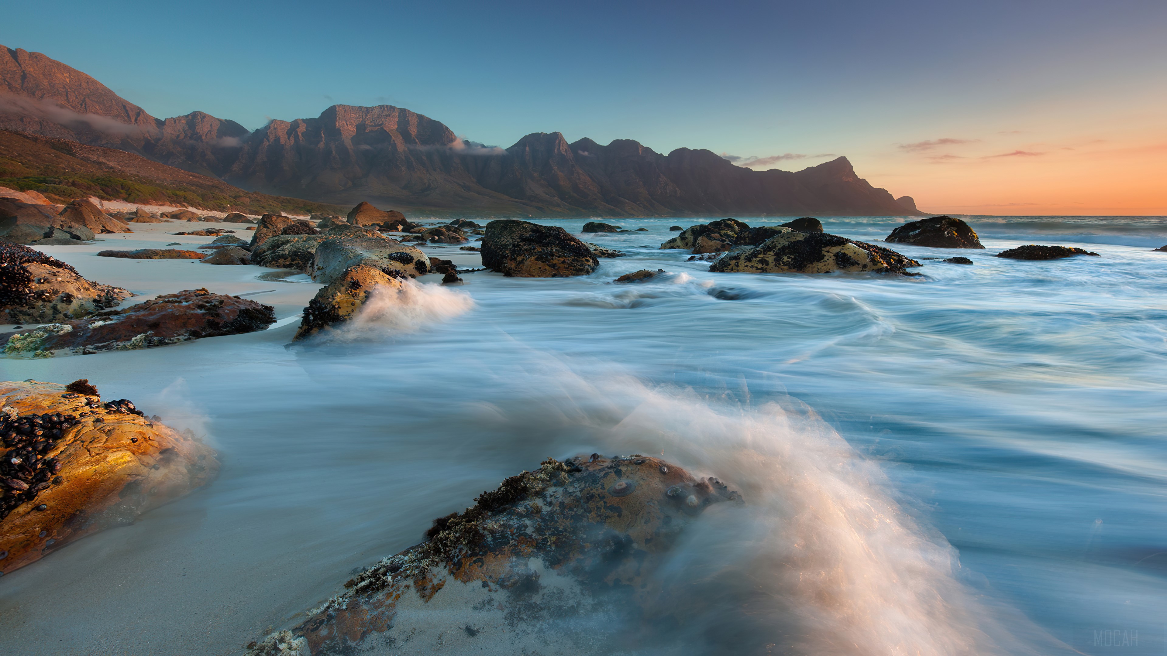 Rocky Beach with Mountains and Ocean Waves Long Exposure 4K HD Wallpaper