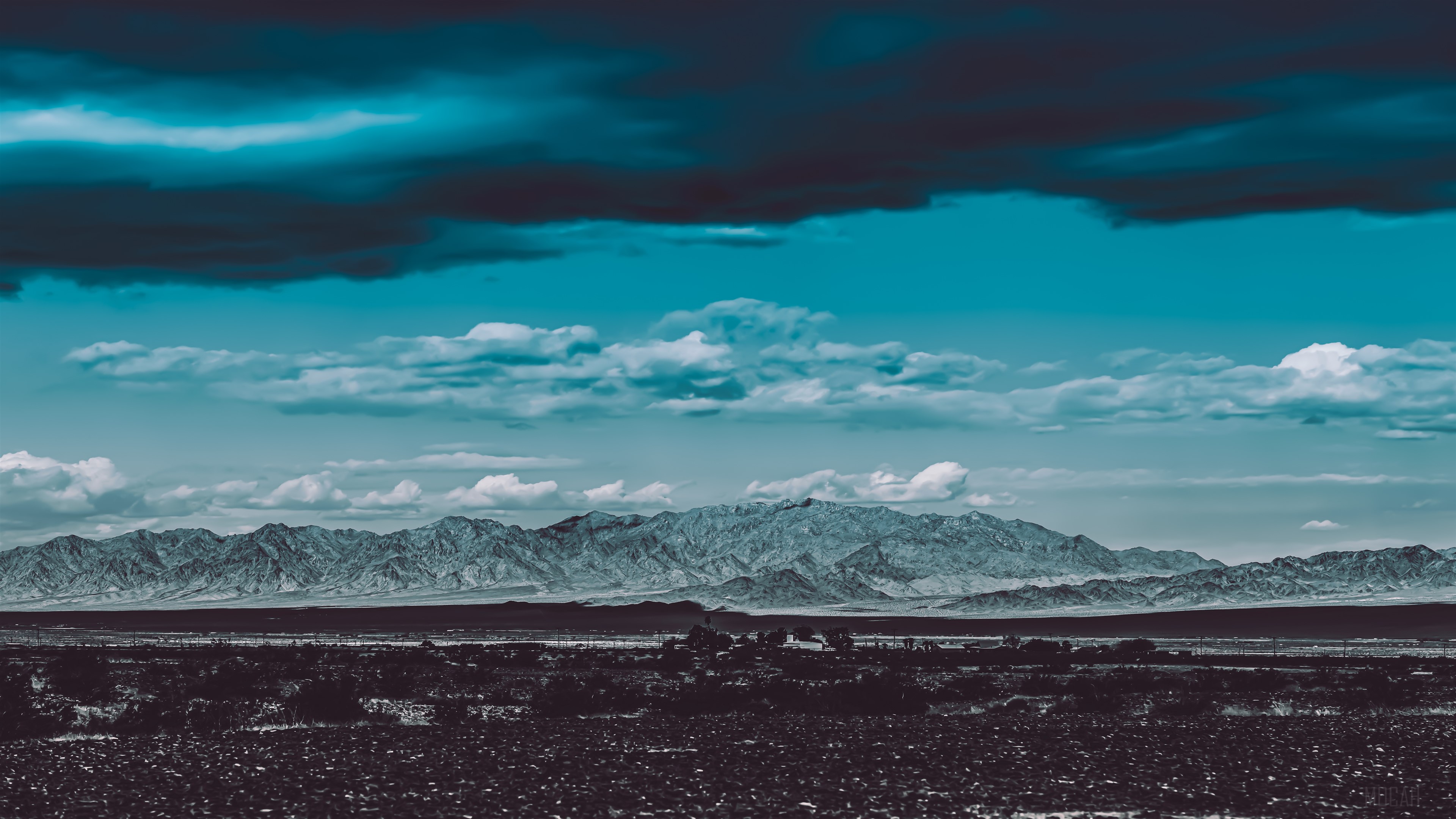 Mountain Range Under Dramatic Sky HD Wallpaper