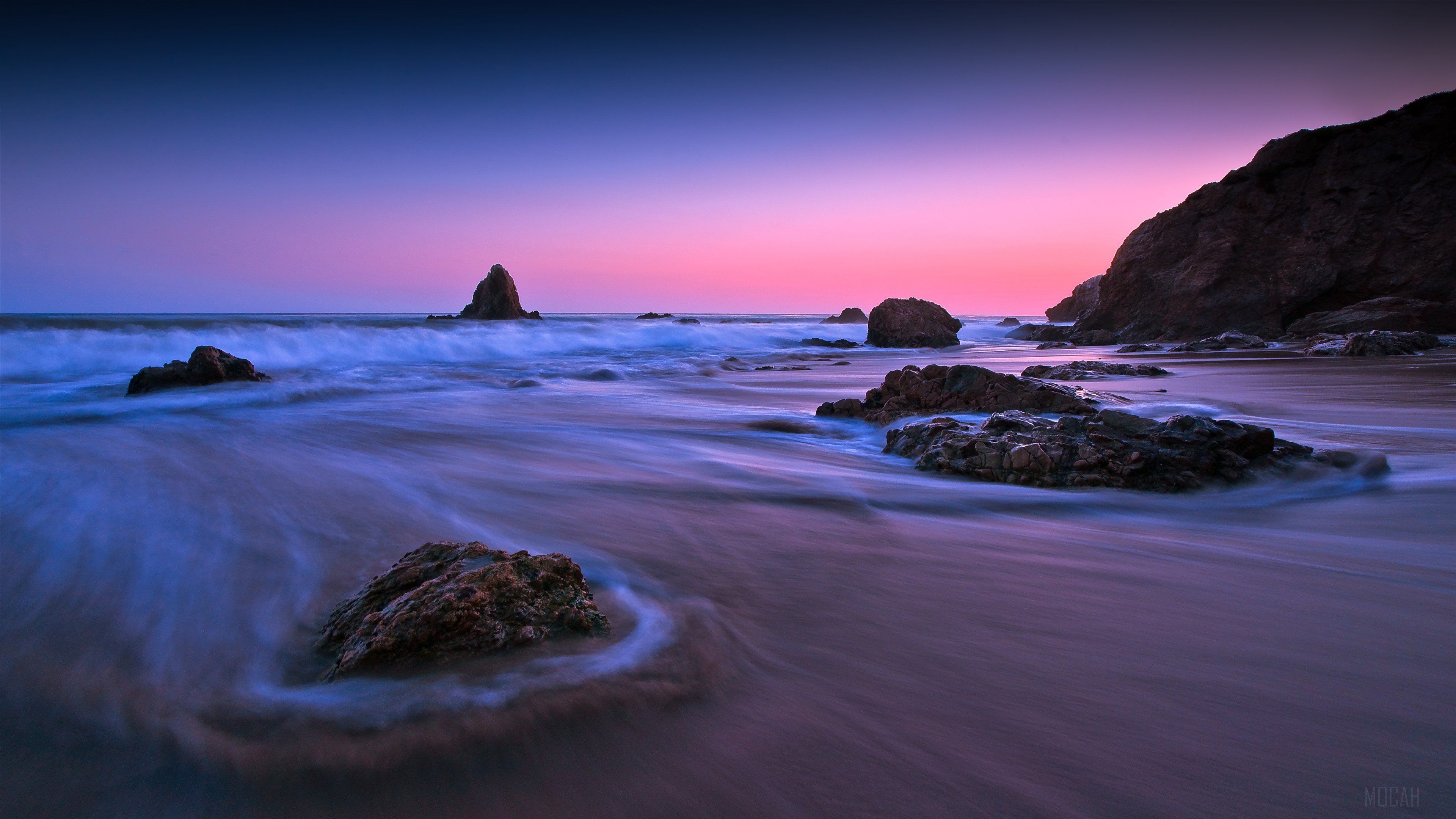 Ocean waves crashing on rocks at sunset, long exposure HD Wallpaper