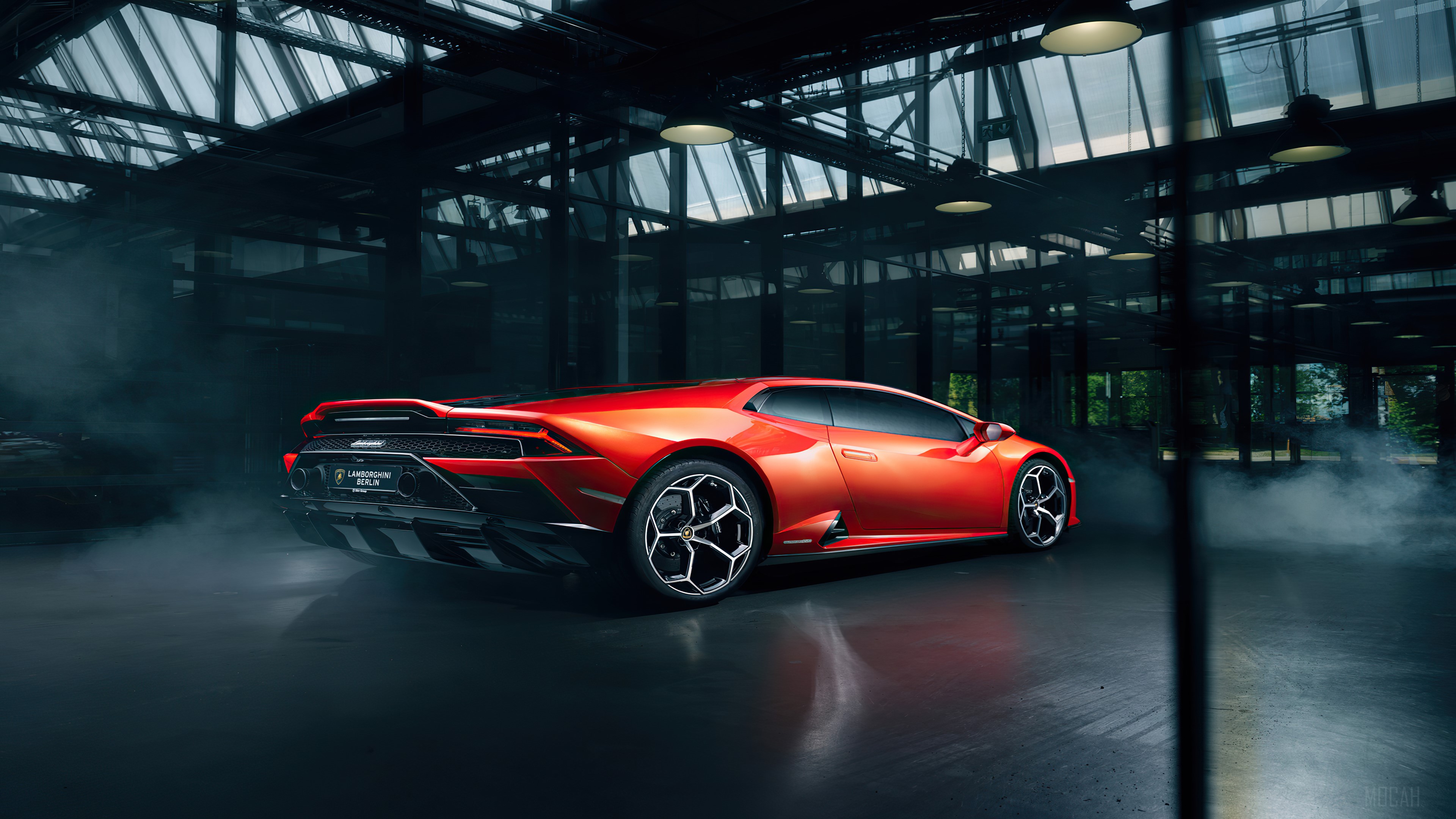 Orange Lamborghini Huracan in a dark garage HD Wallpaper