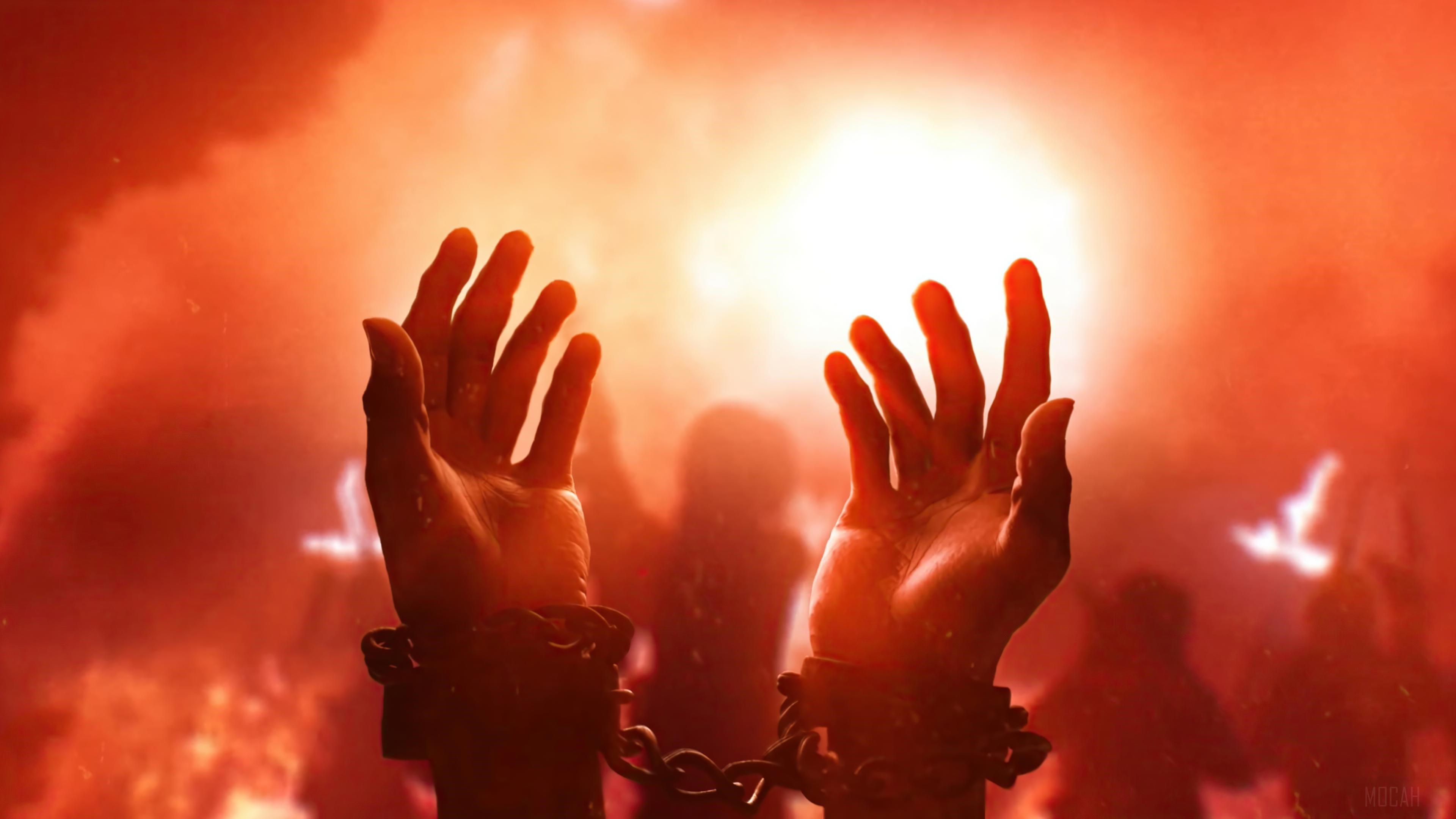 Chained hands in front of a bright light and crowd HD Wallpaper