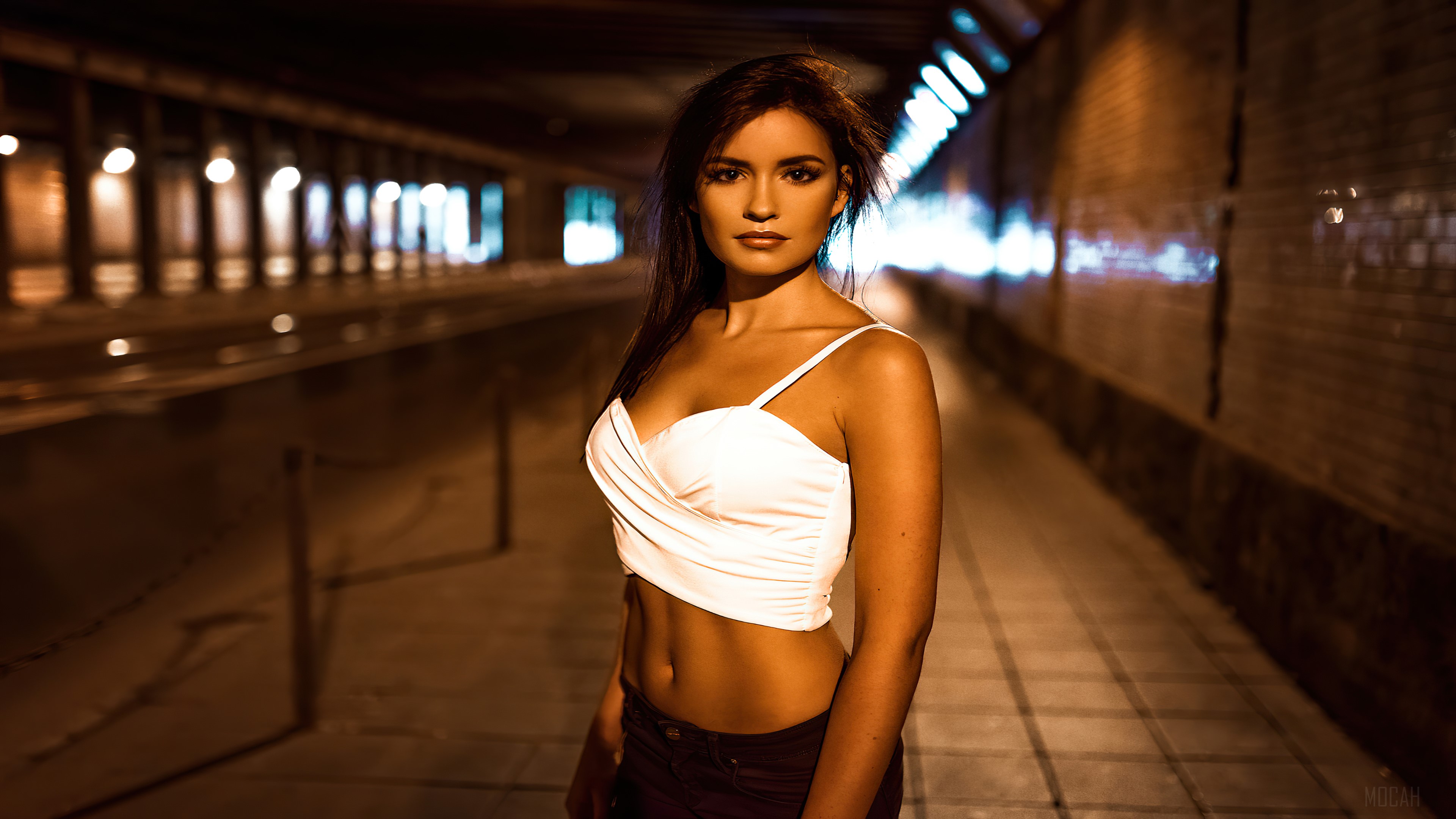 Woman in white top in dark tunnel HD Wallpaper