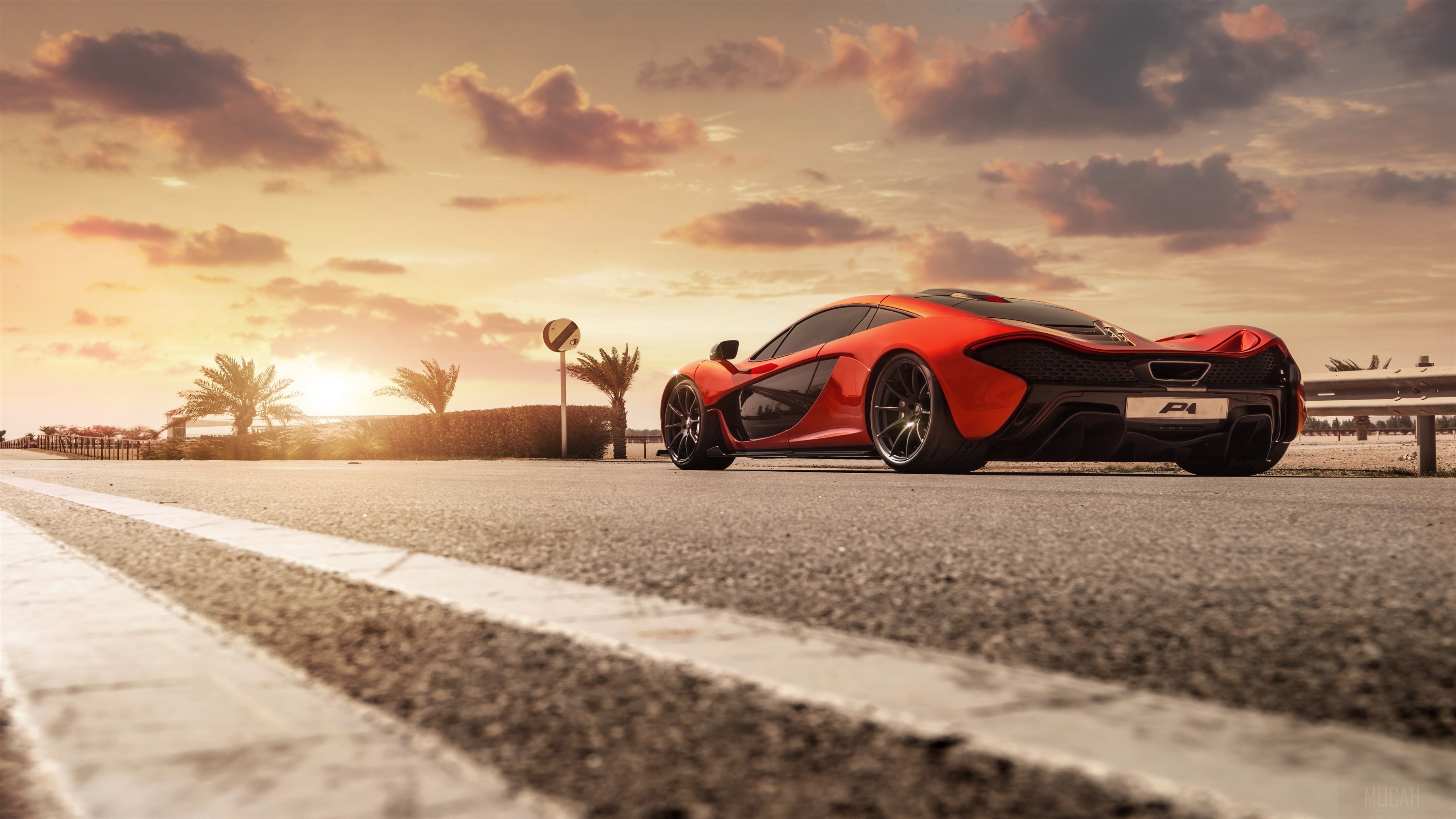 Red McLaren P1 on a road at sunset HD Wallpaper