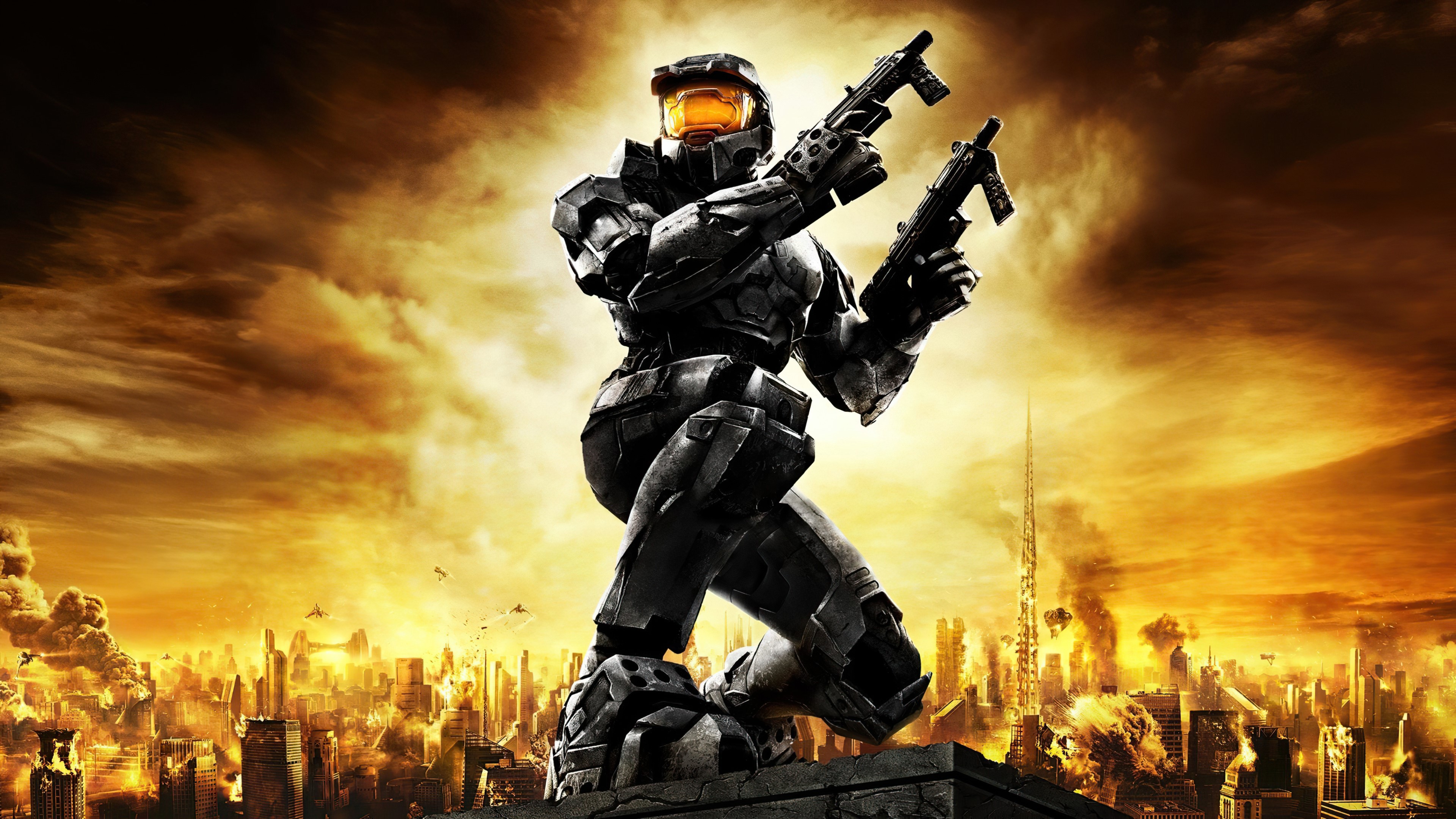 Master Chief from Halo holding two guns in a destroyed city HD Wallpaper