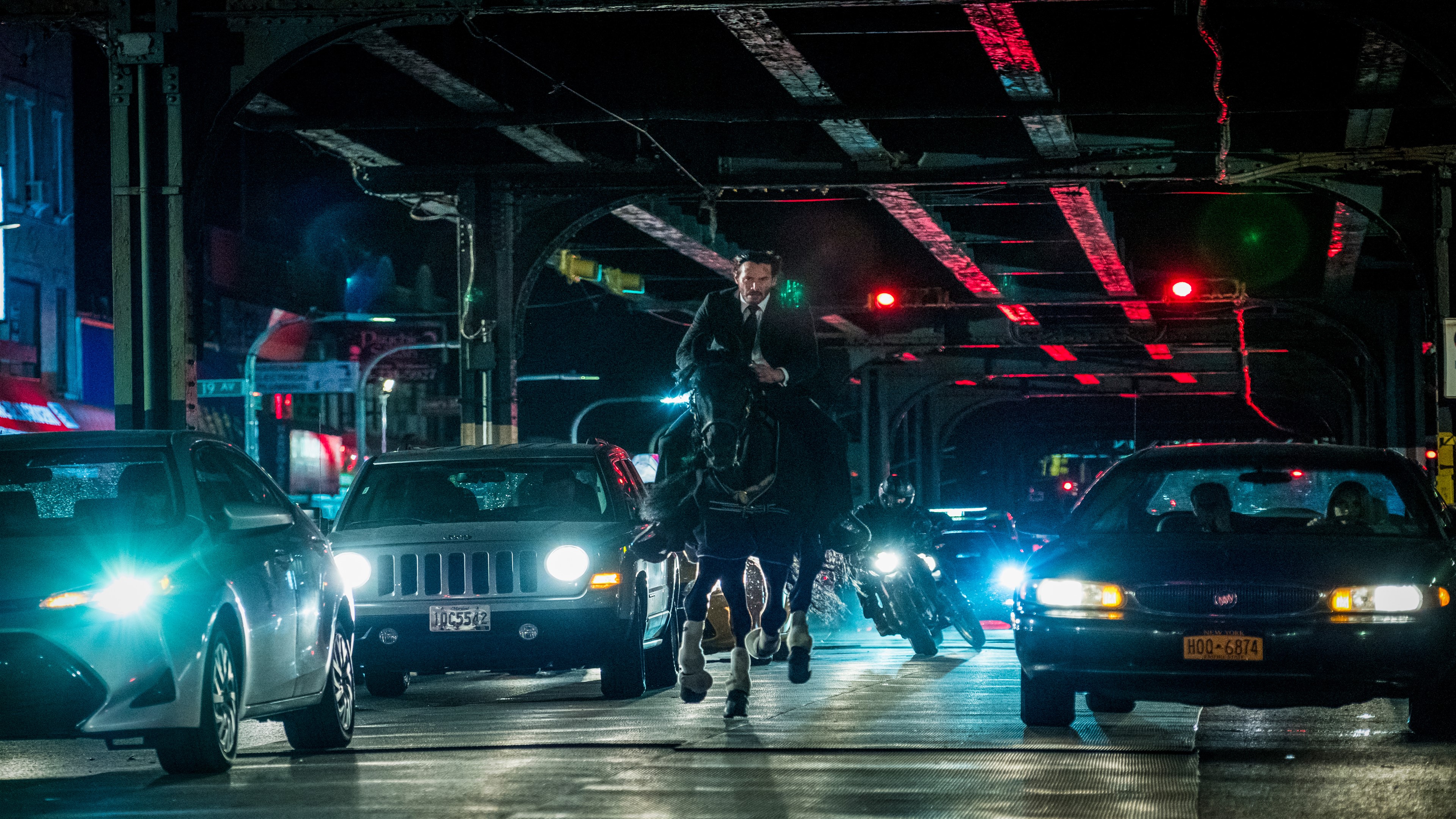 John Wick on horseback in traffic HD Wallpaper