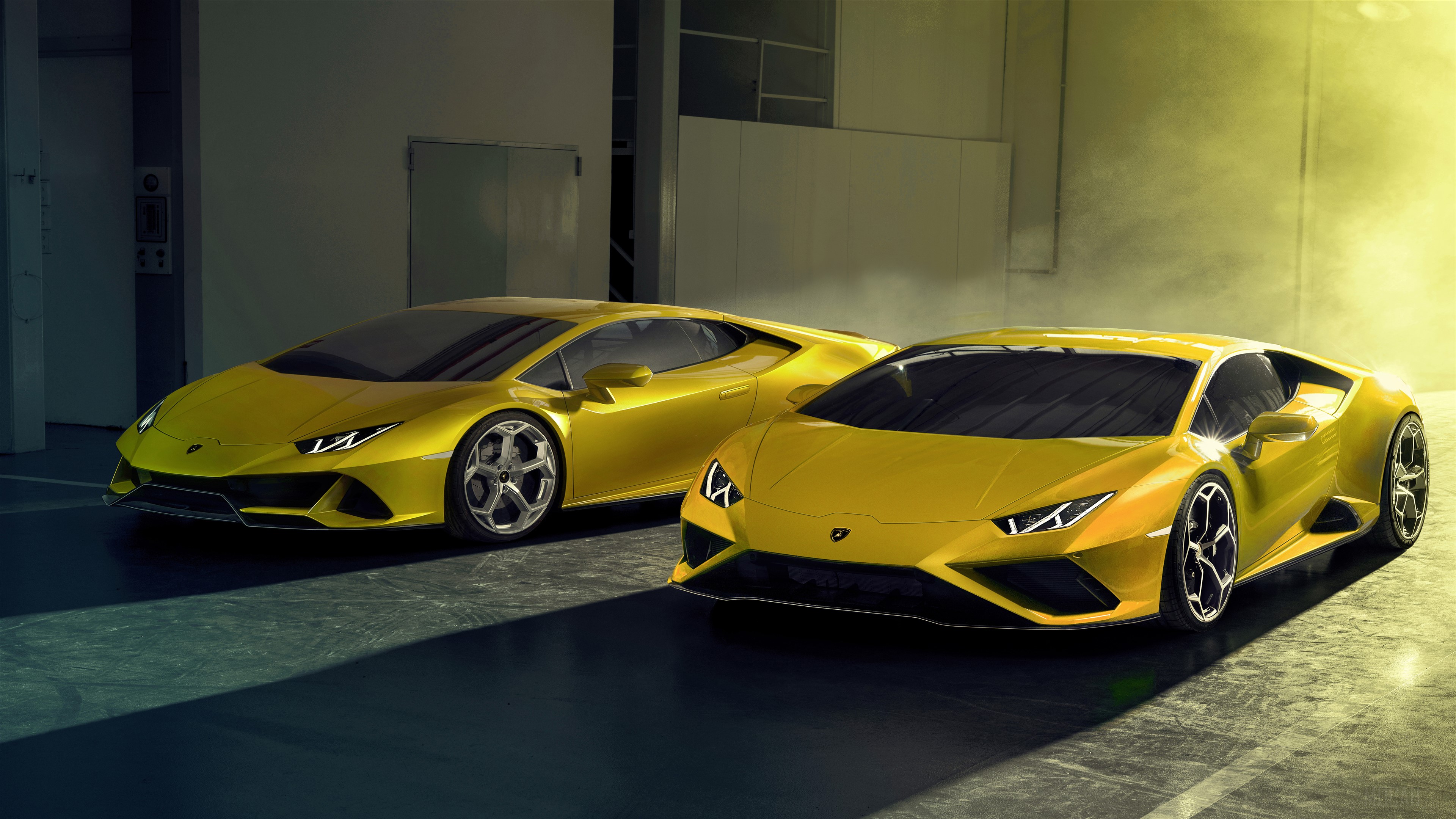 Two yellow Lamborghini Huracan EVO RWD 2020 cars HD Wallpaper