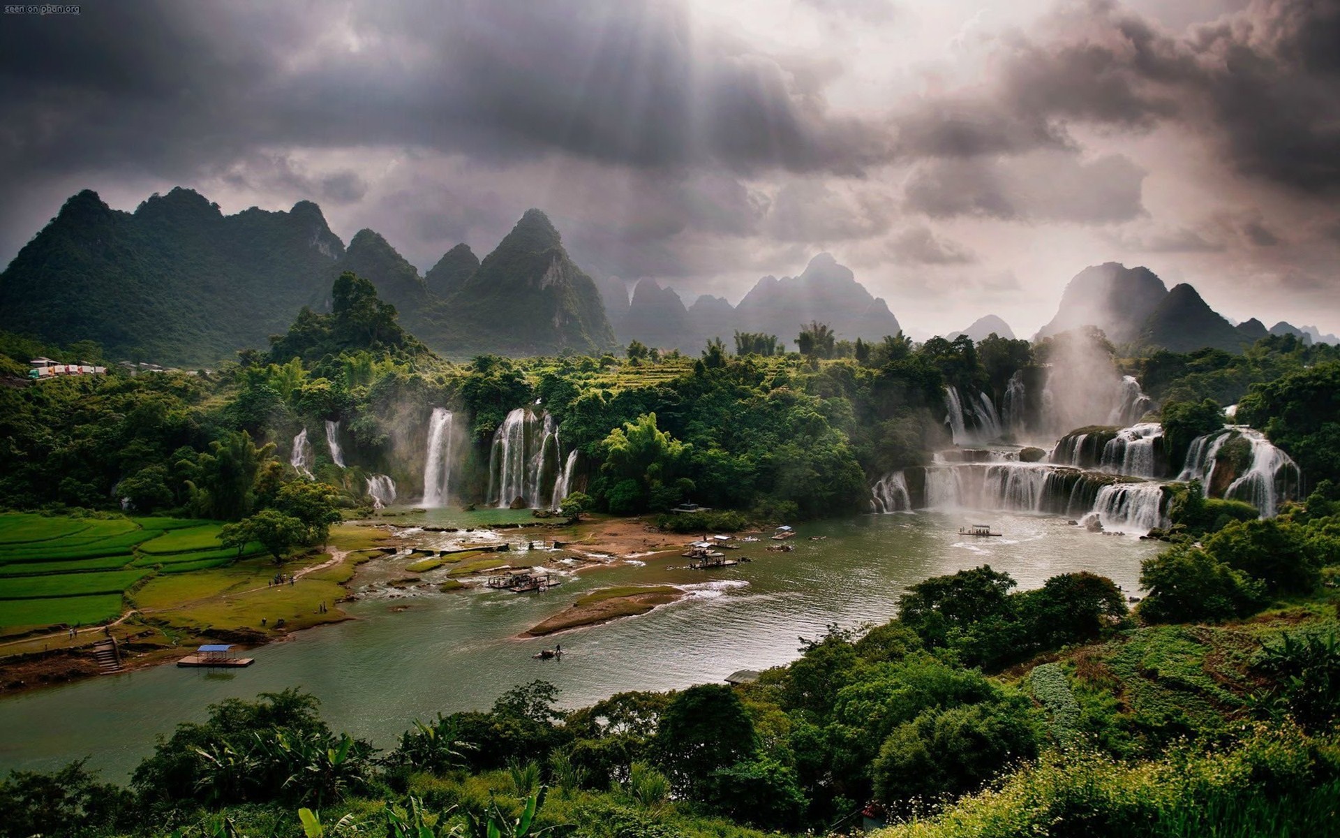Detian Waterfall and karst mountains under cloudy sky HD Wallpaper
