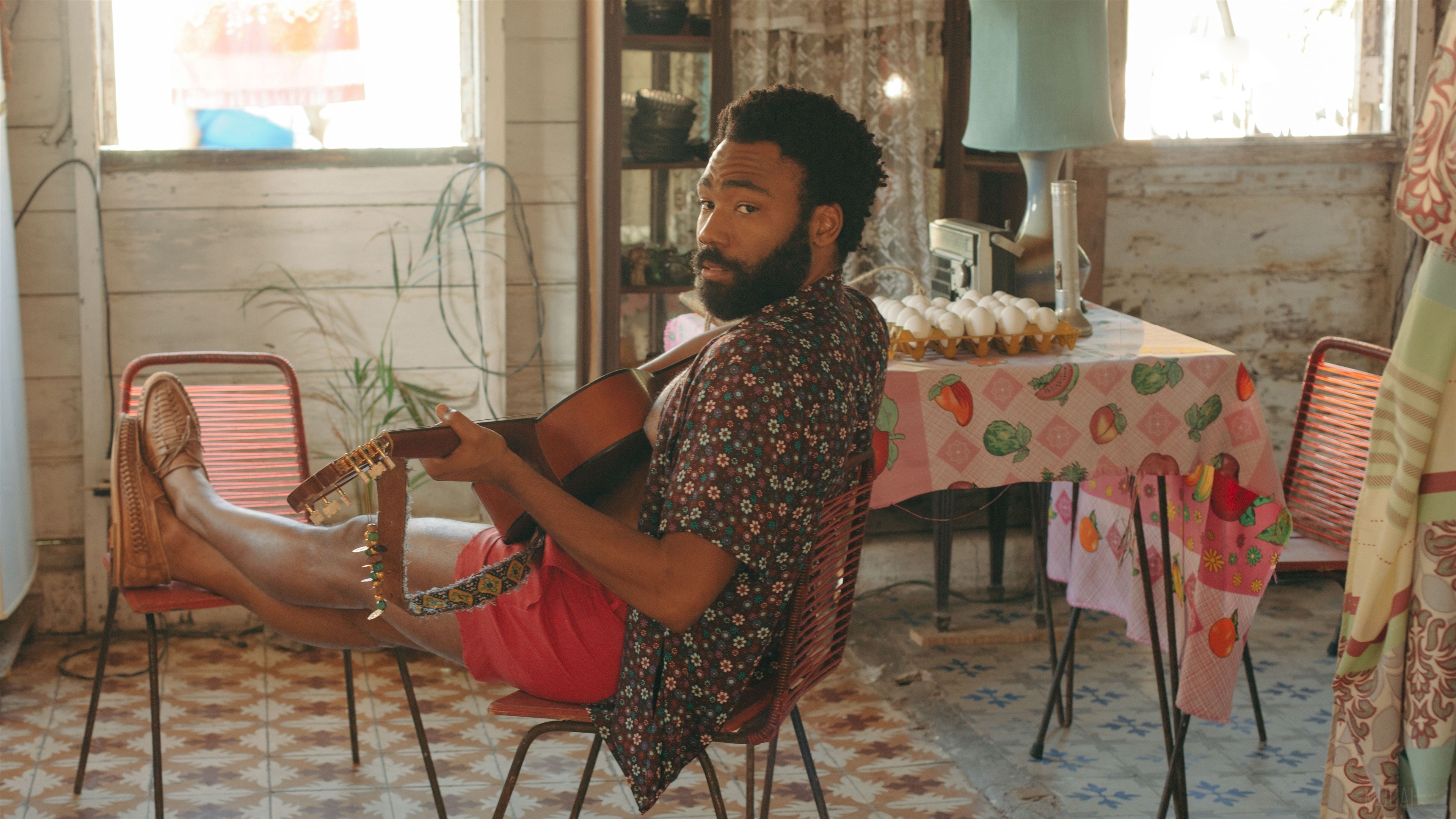 Donald Glover playing guitar in Guava Island 4K HD Wallpaper