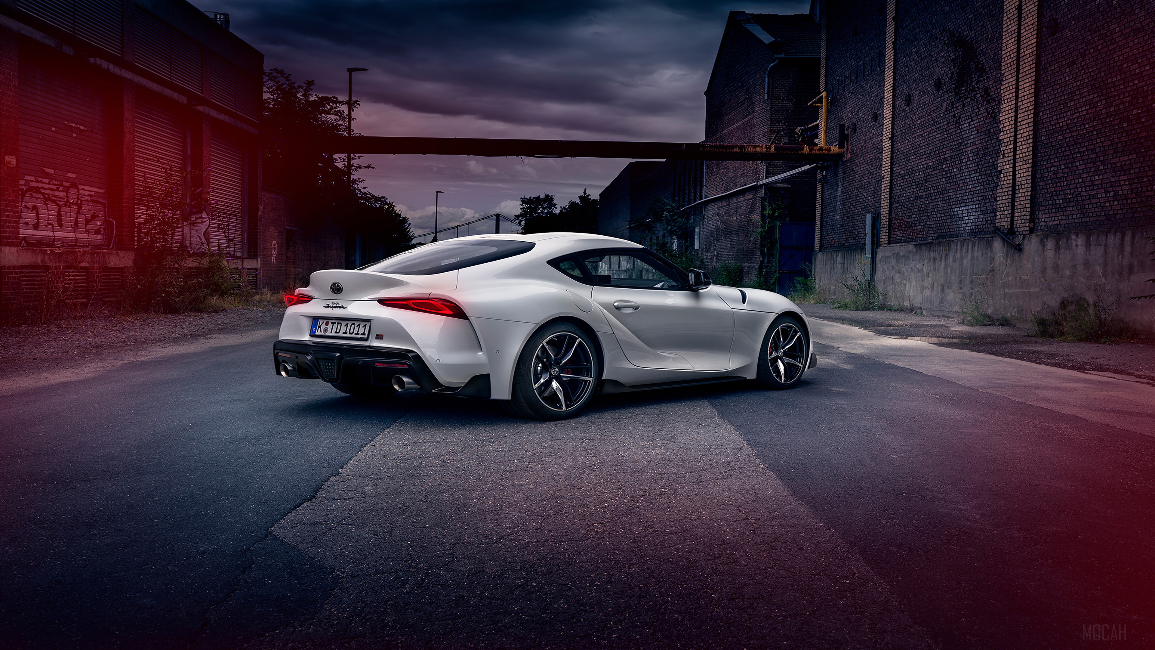 White Toyota Supra parked in an industrial area HD Wallpaper