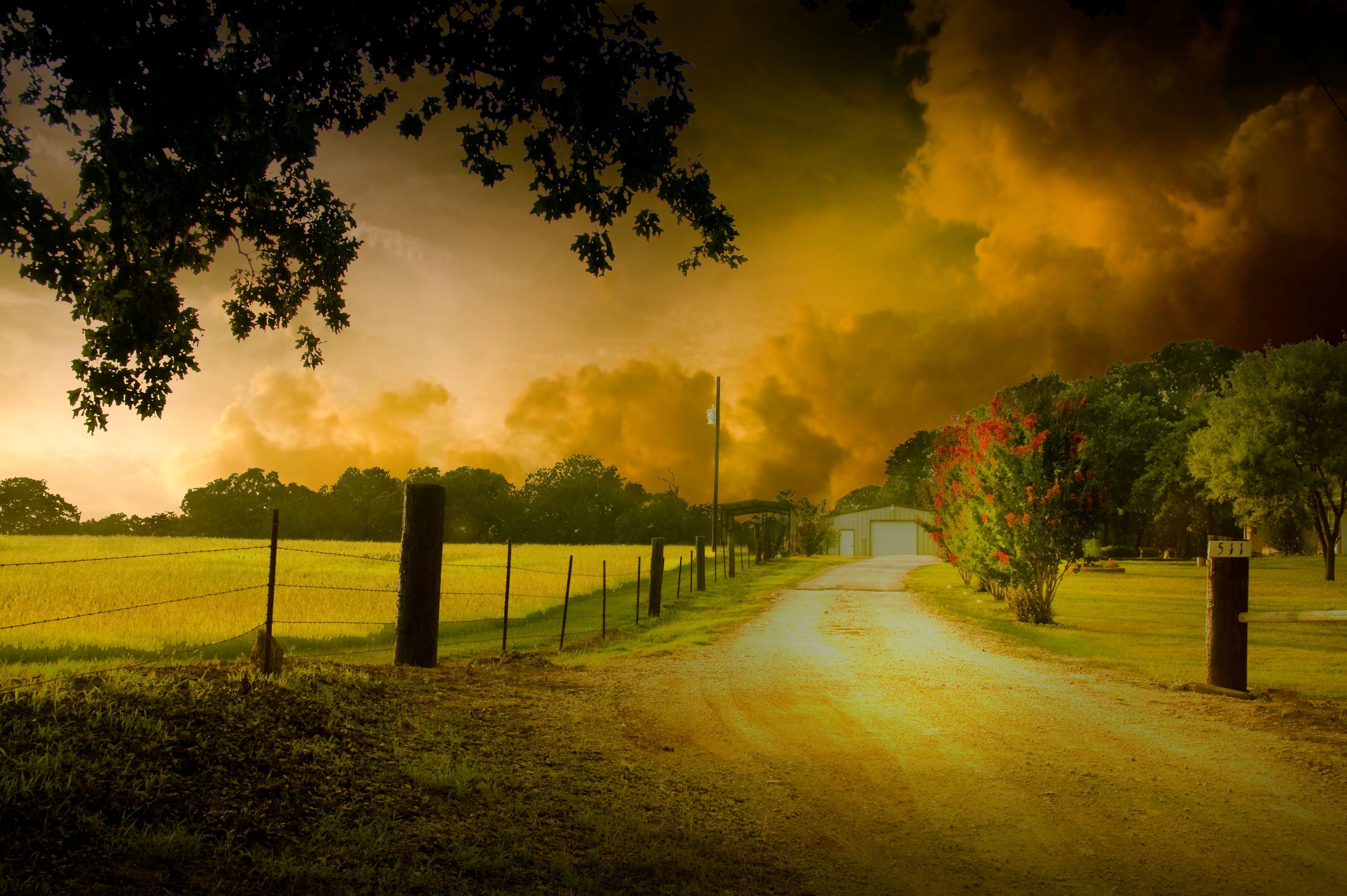 Farmhouse driveway with stormy sky HD Wallpaper