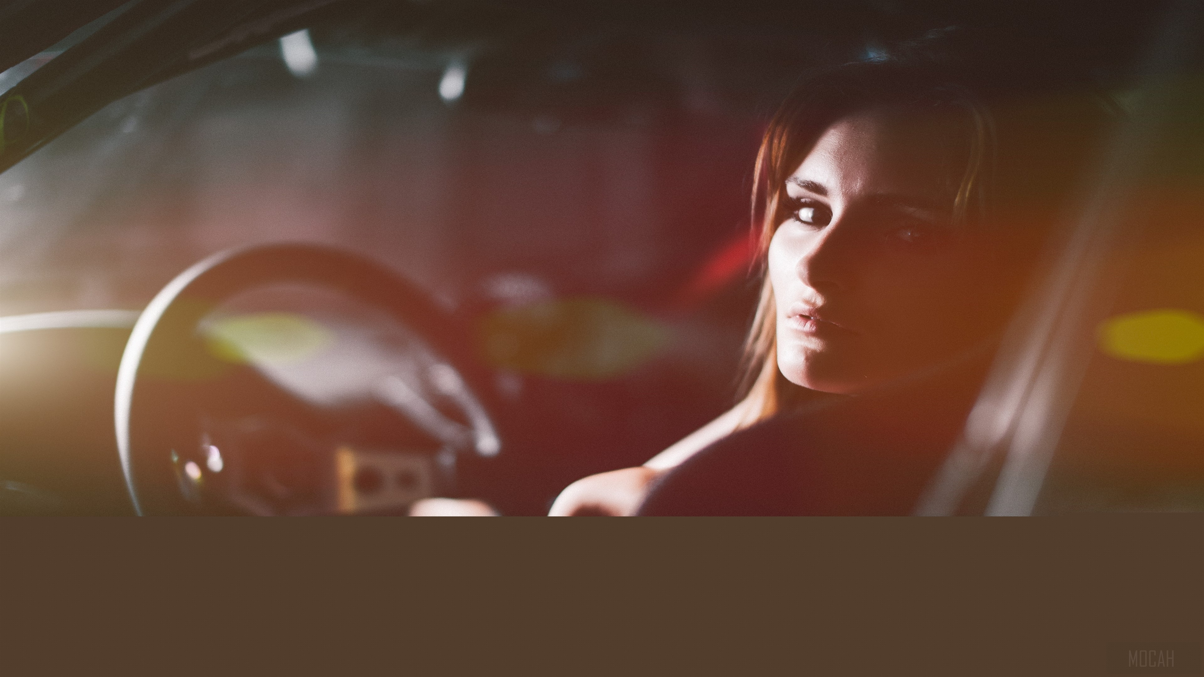 Woman in car looking back HD Wallpaper
