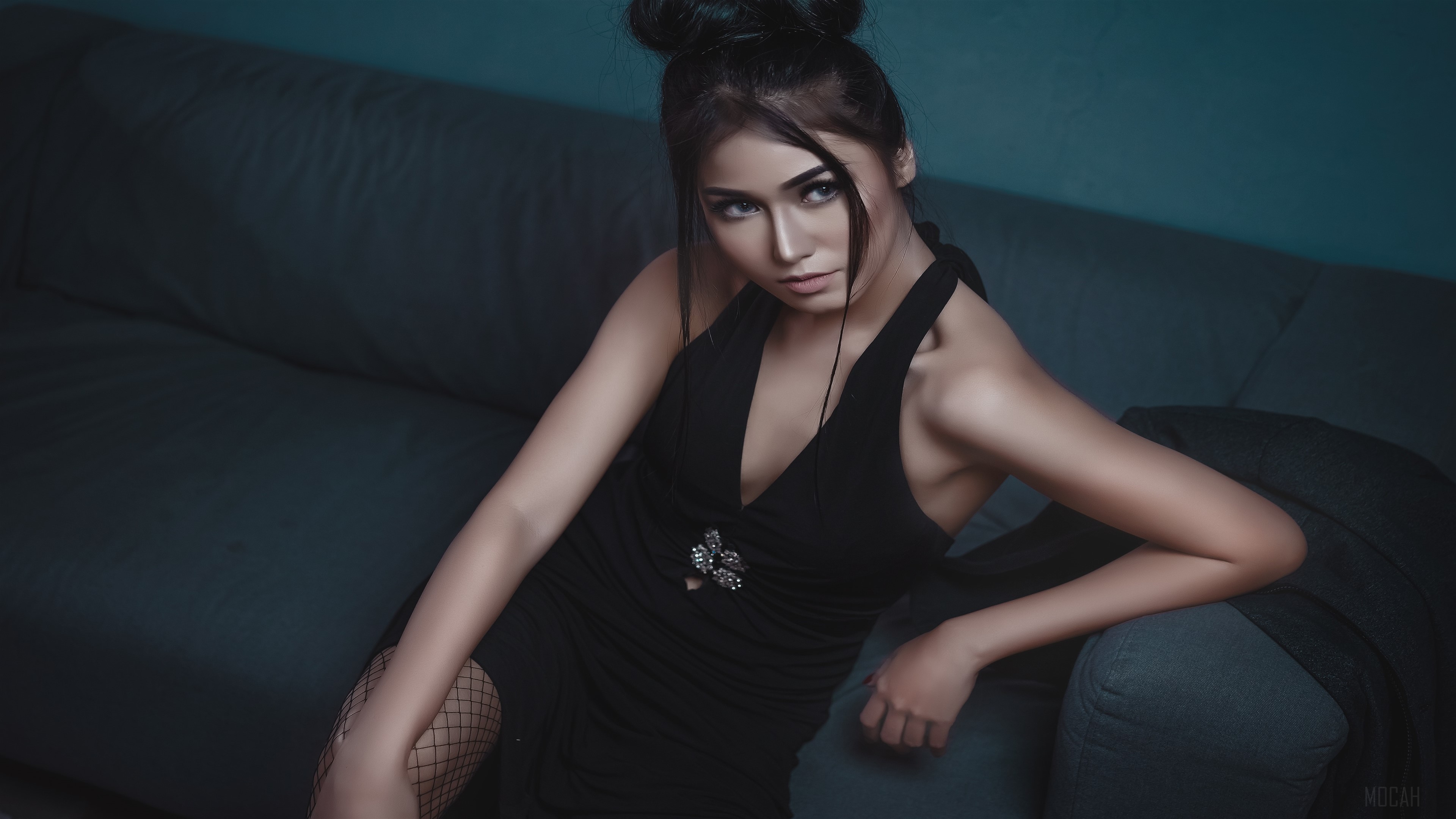 Woman in black dress on a couch 4K HD Wallpaper