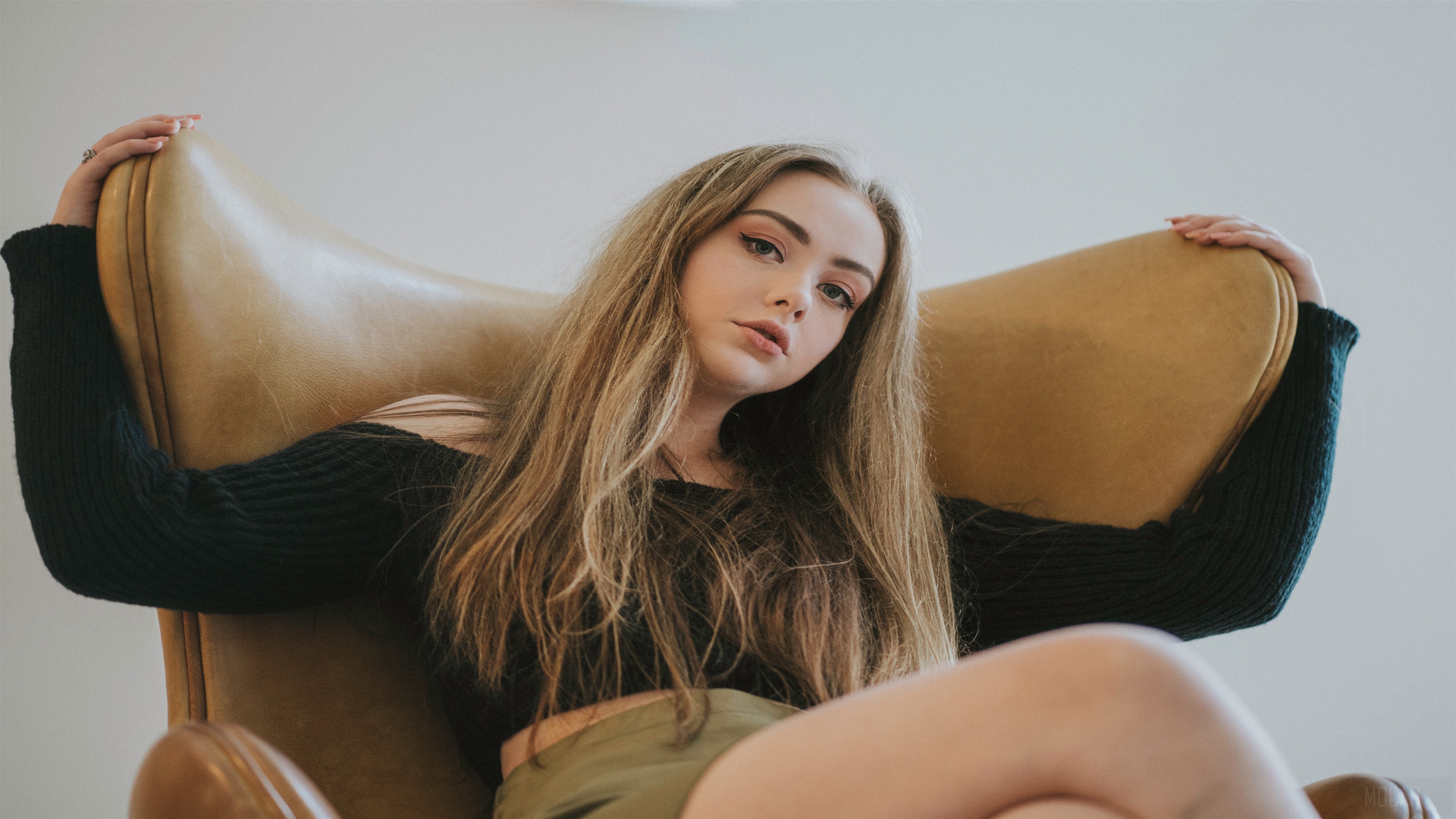 Beautiful Model Sitting On Chair 4K HD Wallpaper
