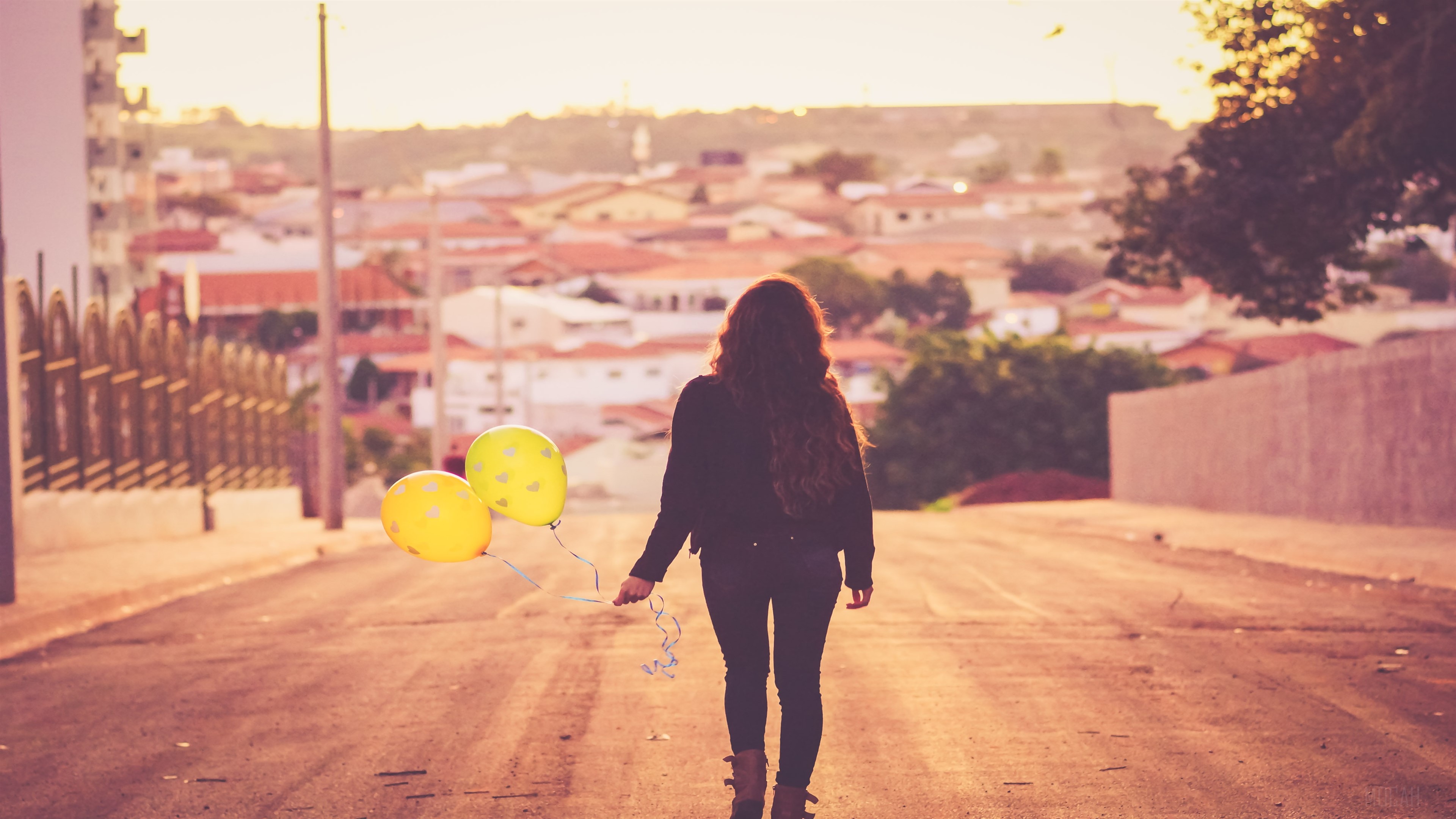 Girl with yellow balloons walking away HD Wallpaper