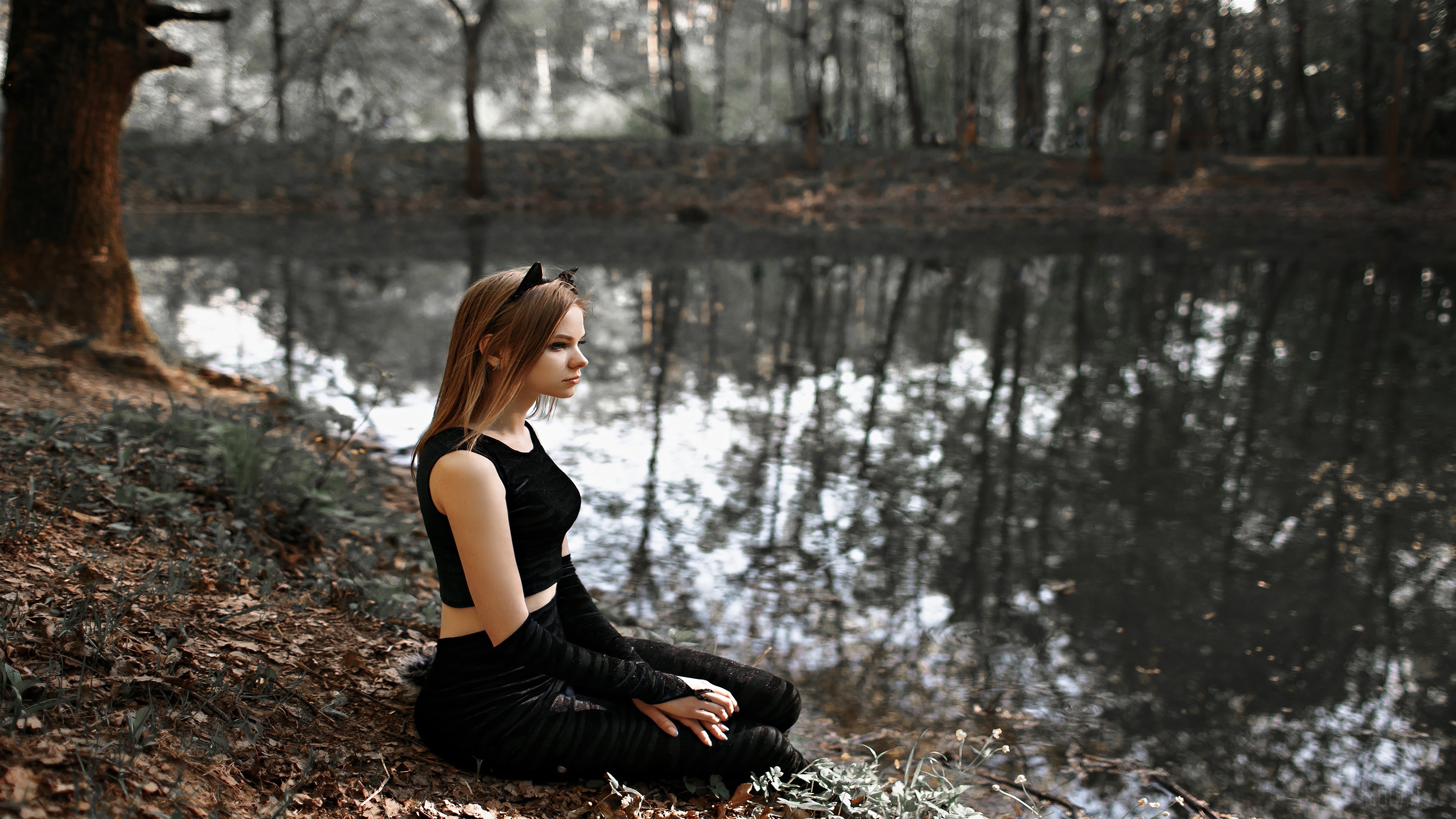 Girl in black clothing with cat ears by the water HD Wallpaper