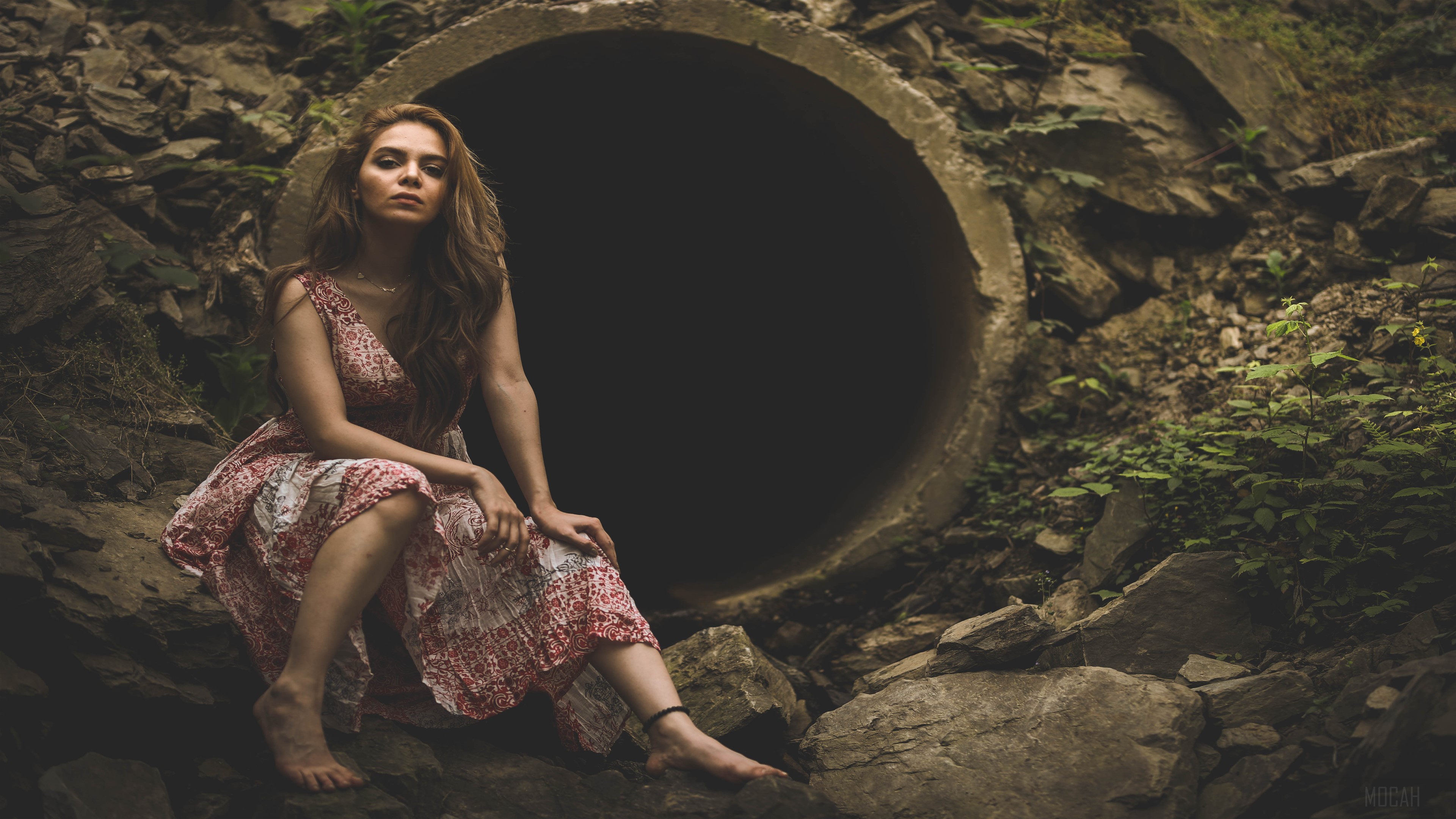 Woman sitting in front of concrete pipe 4K HD Wallpaper