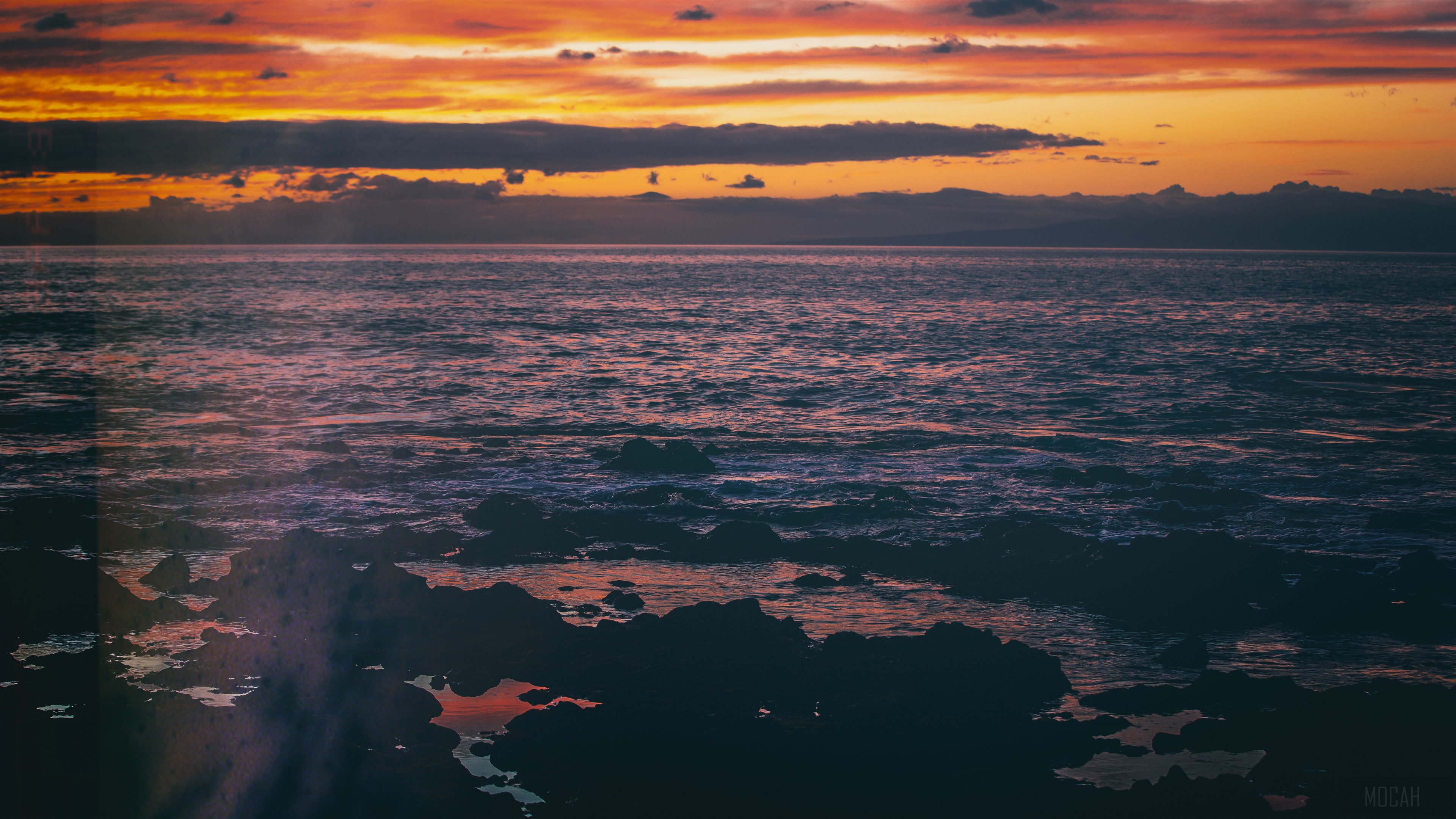 Sunset over the sea with rocky shore HD Wallpaper